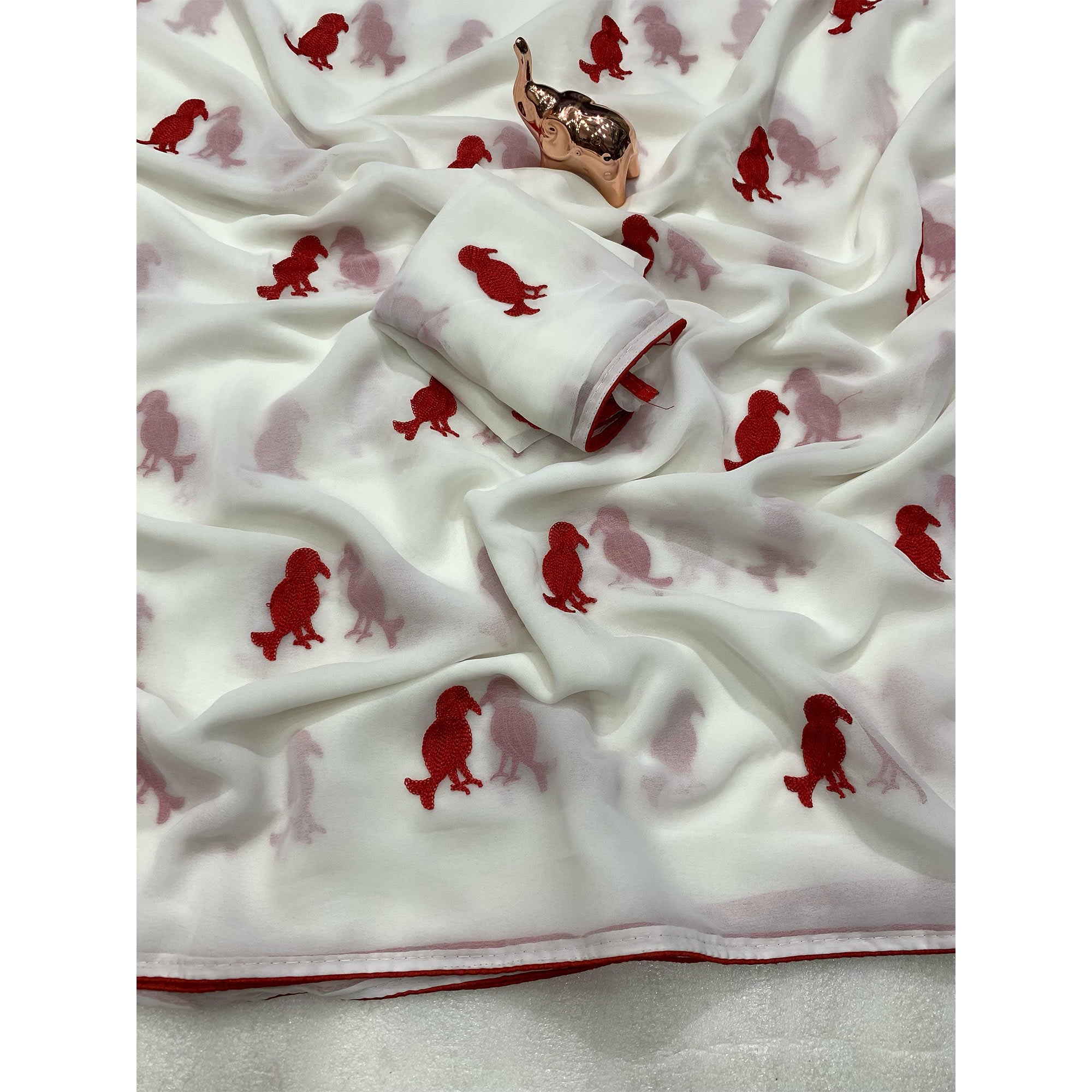 White Georgette Saree Adorned With Elegant Bird Embroidery.