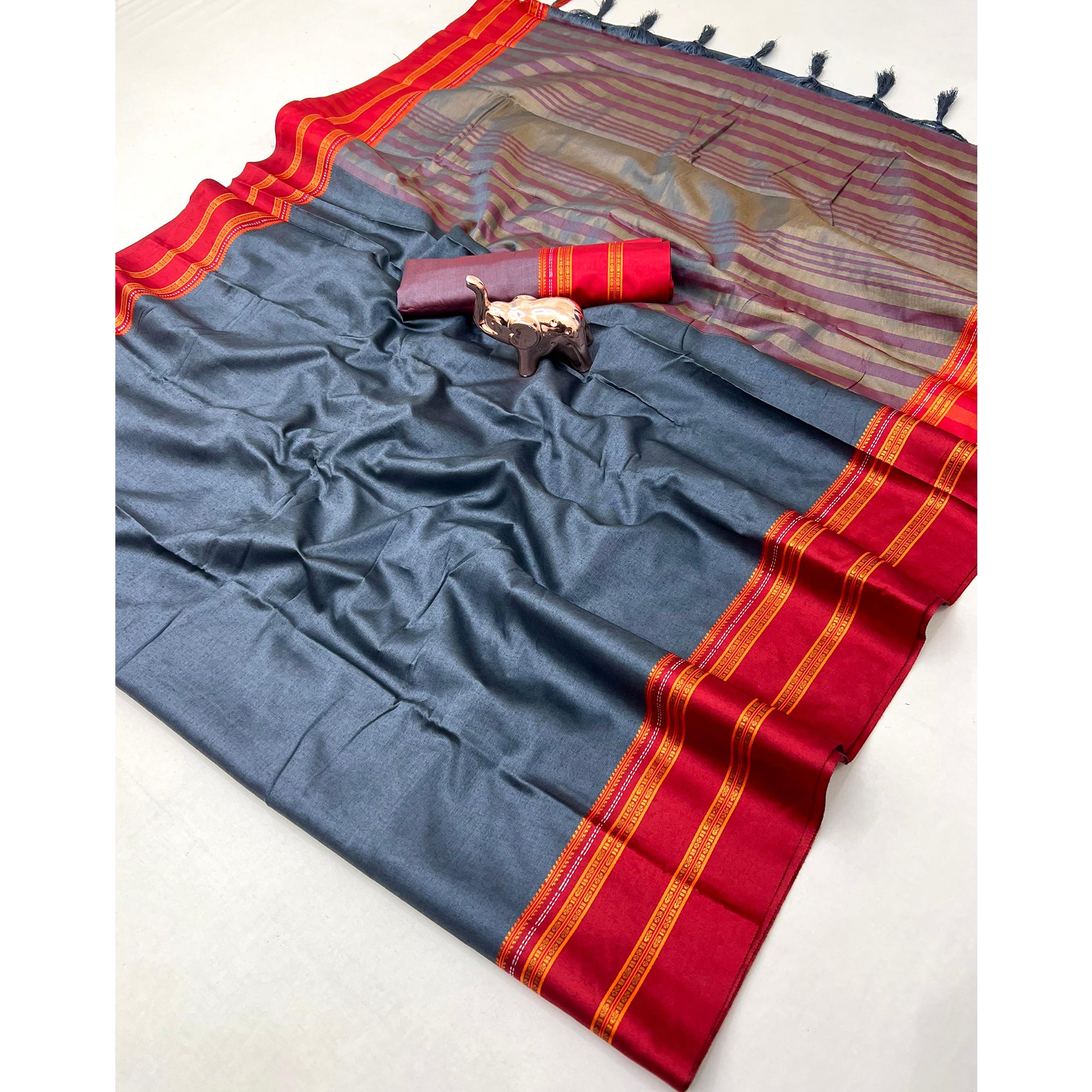 Classic Grey Solid Weaving Pure Silk Saree Accented With Woven Striped Pallu & Tassel Finish