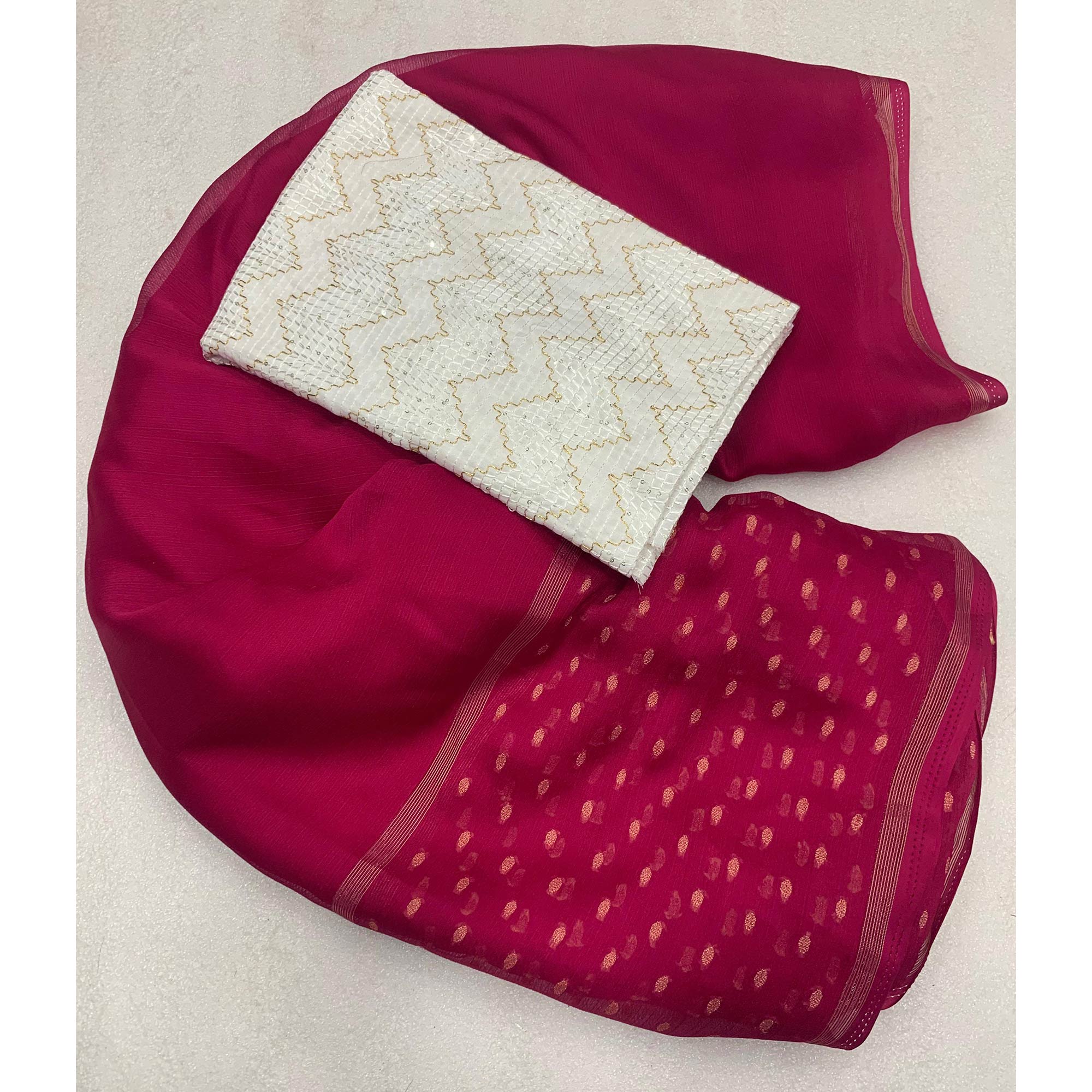 Pink Woven Georgette Saree With Tassels