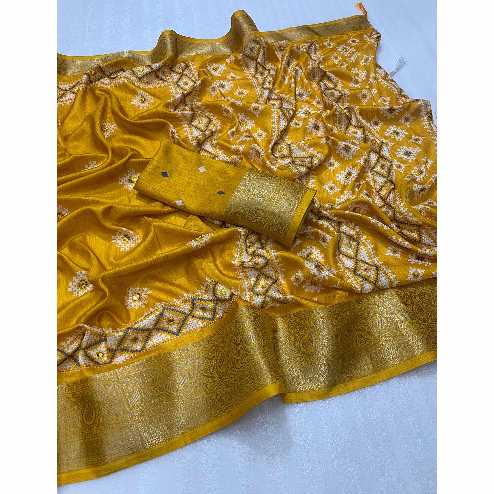 Mustard Printed With Mirror Work Crepe Saree With Tassels