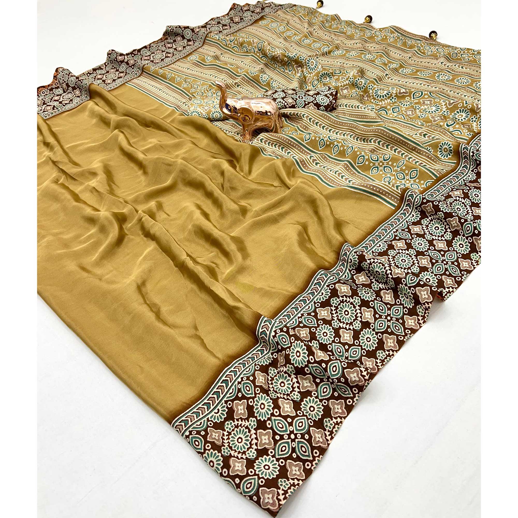 Mustard Solid Satin Saree Featuring Bold Ajrakh Print and Tassel Accented Pallu