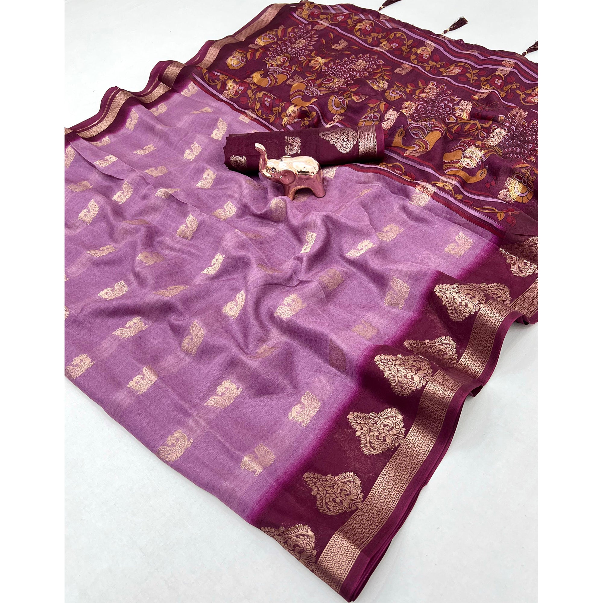 Elegant Purple Peacock Pattern Zari Weaving Georgette Saree With Tassel Pallu