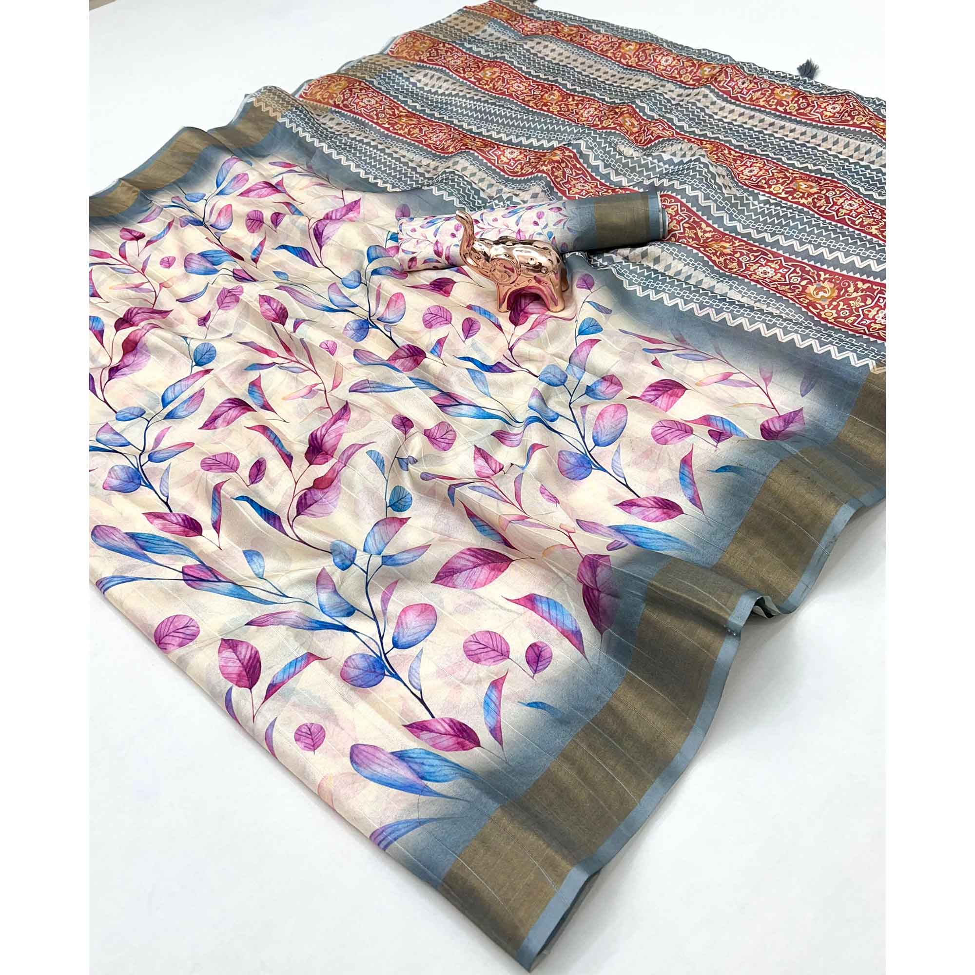 Festive Off White Silk Blend Saree with Subtle Floral Print and Shimmering Zari Border