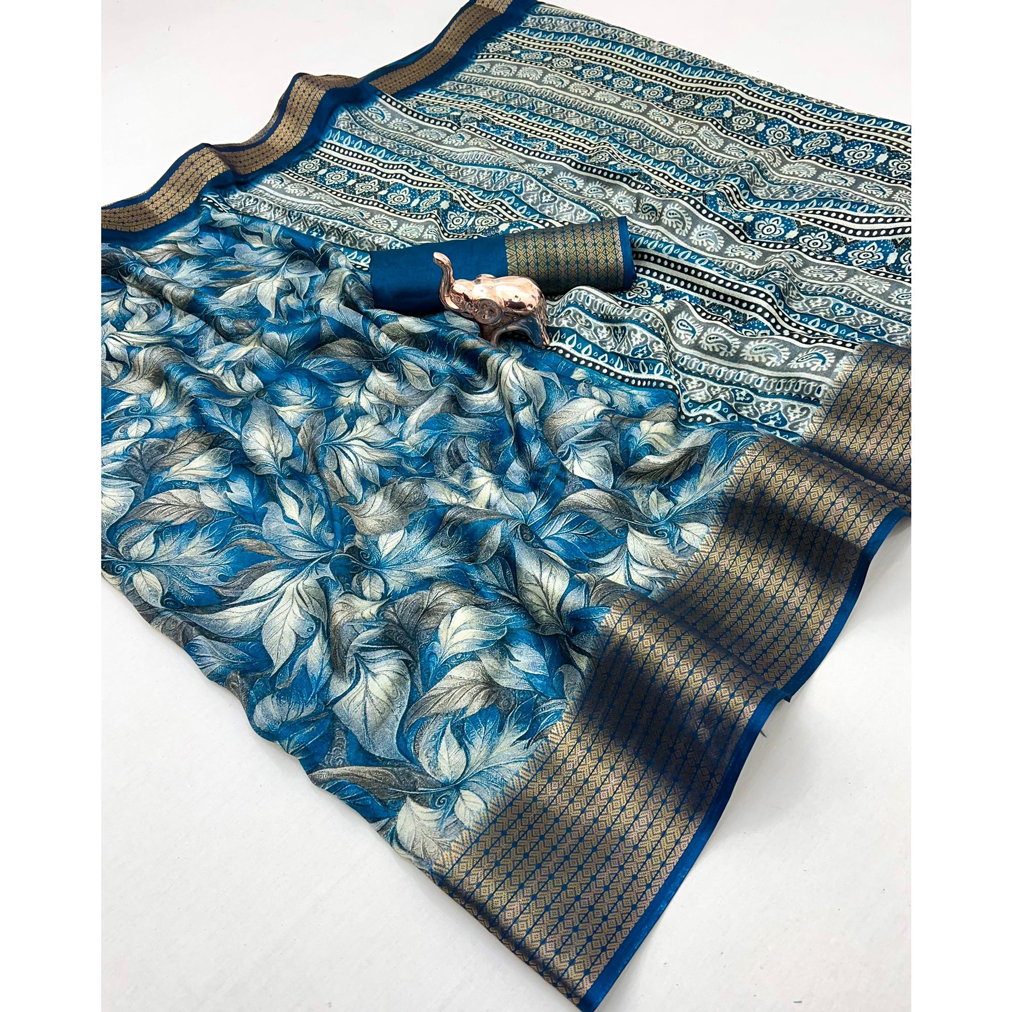 Blue Leaf Printed Dola Silk Marshmallow Saree With Paisley Jaal Pallu & Lustrous Weaving Border