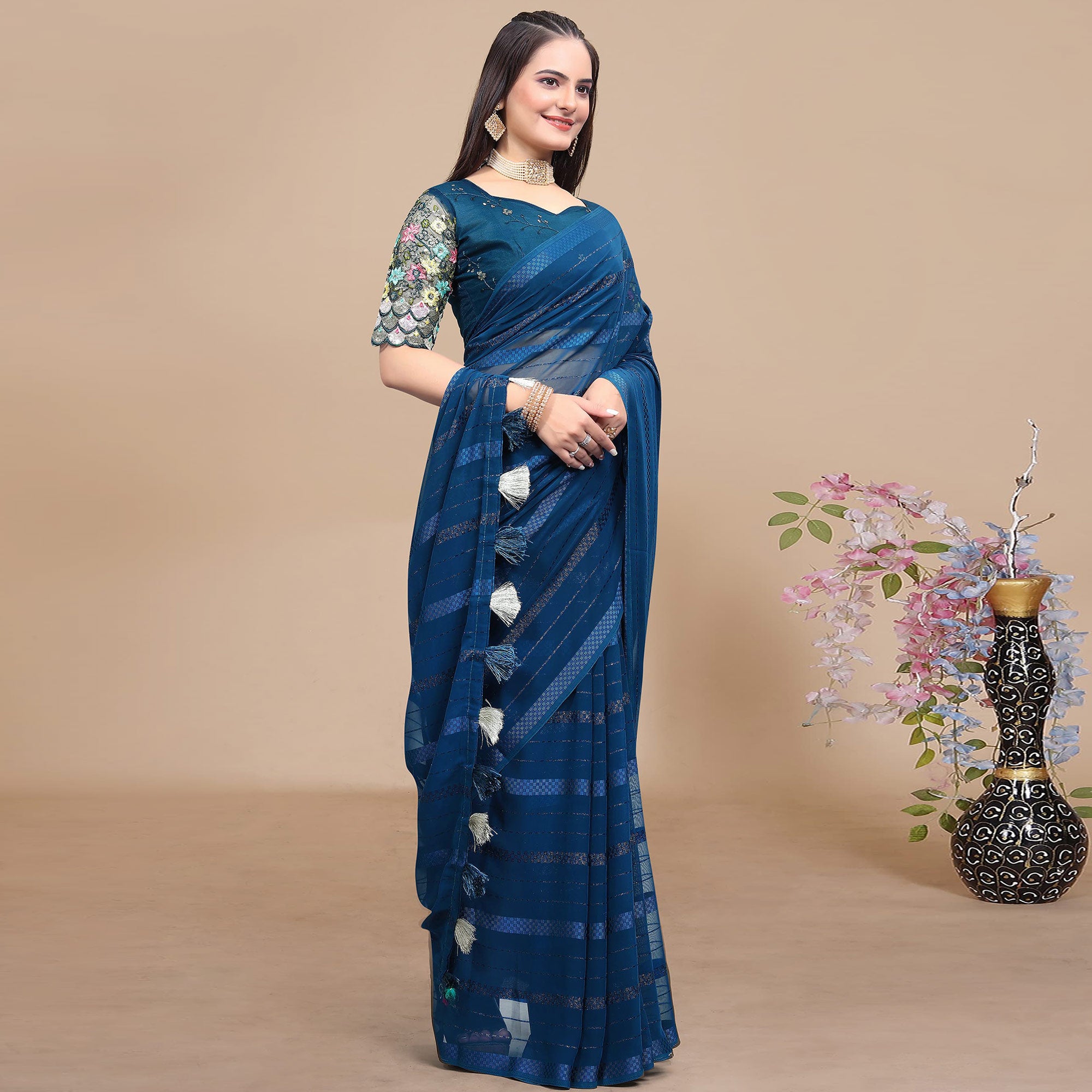 Teal Blue Woven Georgette Saree With Tassels