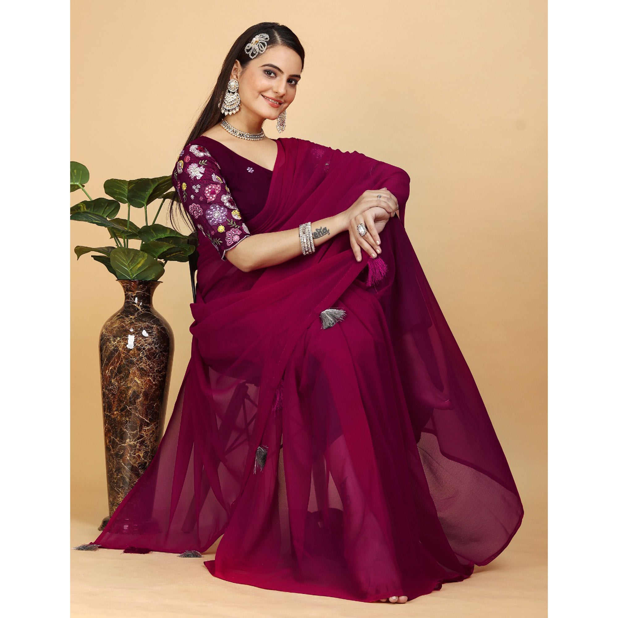 Pink Solid Georgette Saree With Tassels