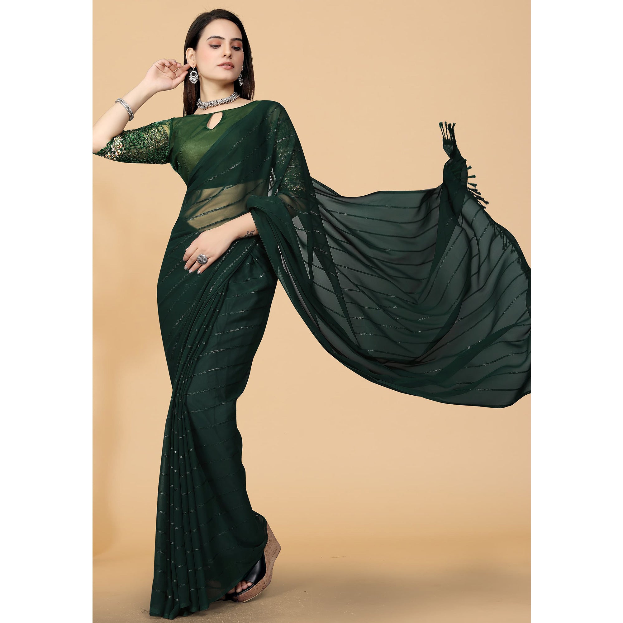 Green Woven Georgette Saree with Tassels