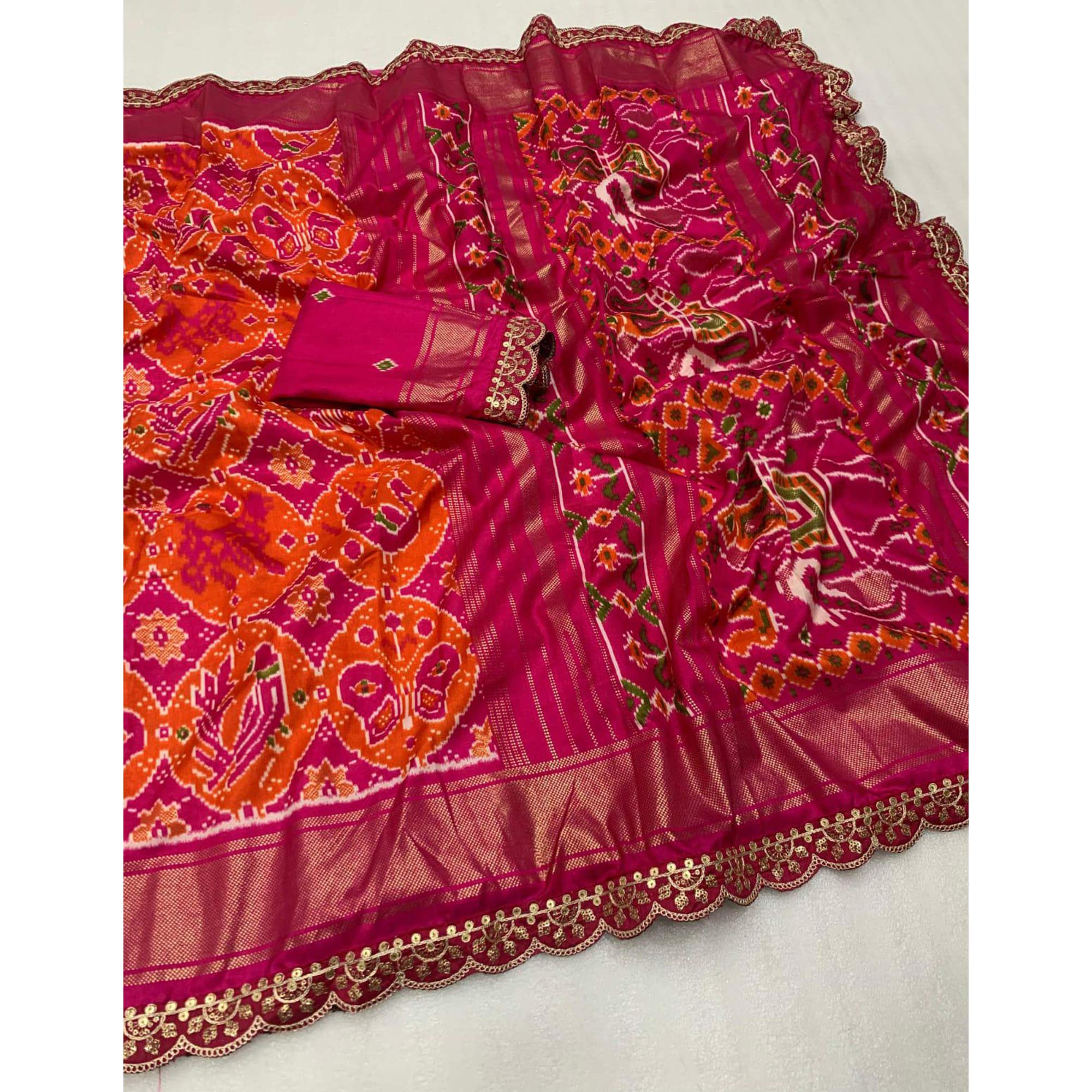 Orange & Pink Ikkat Printed Dola Silk Saree With Sequins Embroidered Border