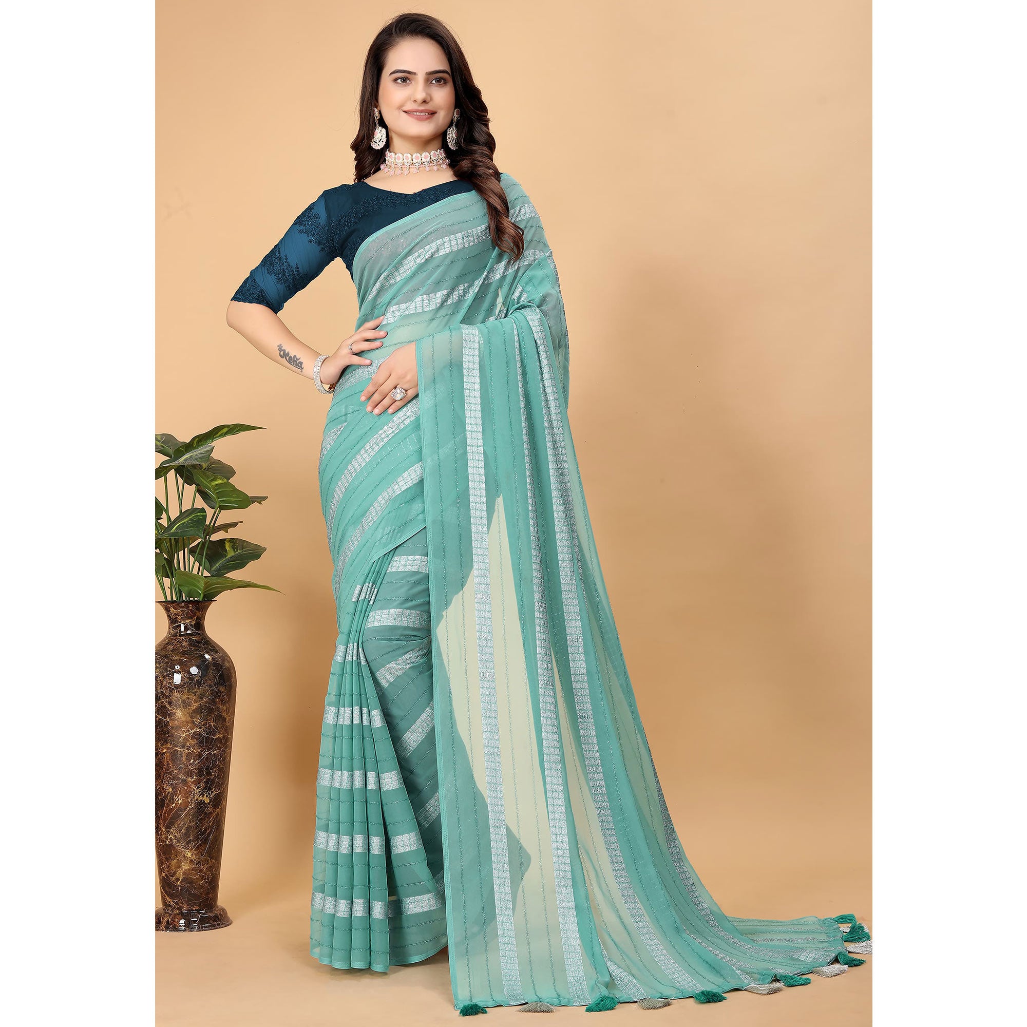 Sea Green Zari Striped Georgette Saree With Tassels