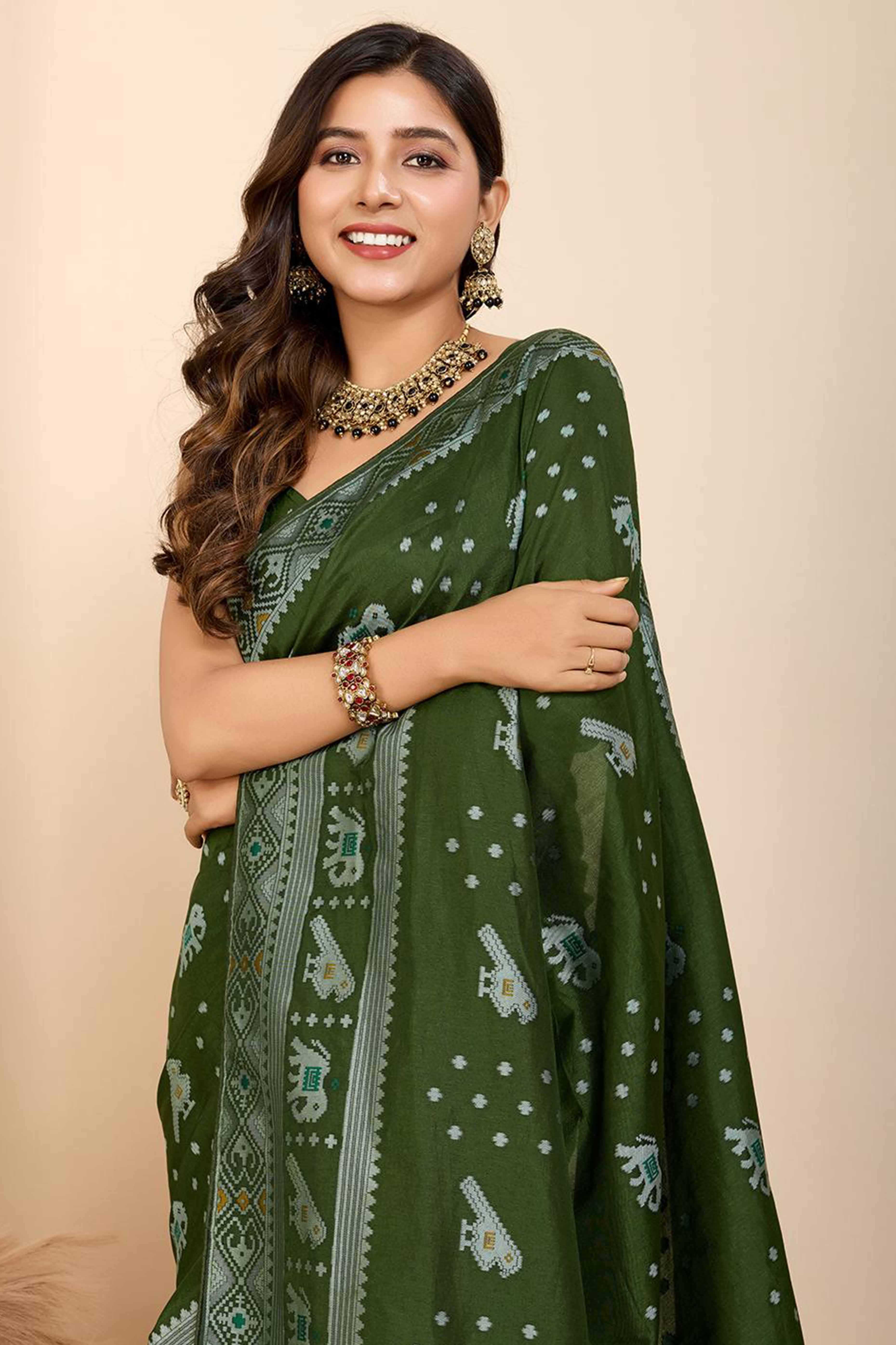 Green Woven Dola Silk Patola Saree With Tassels