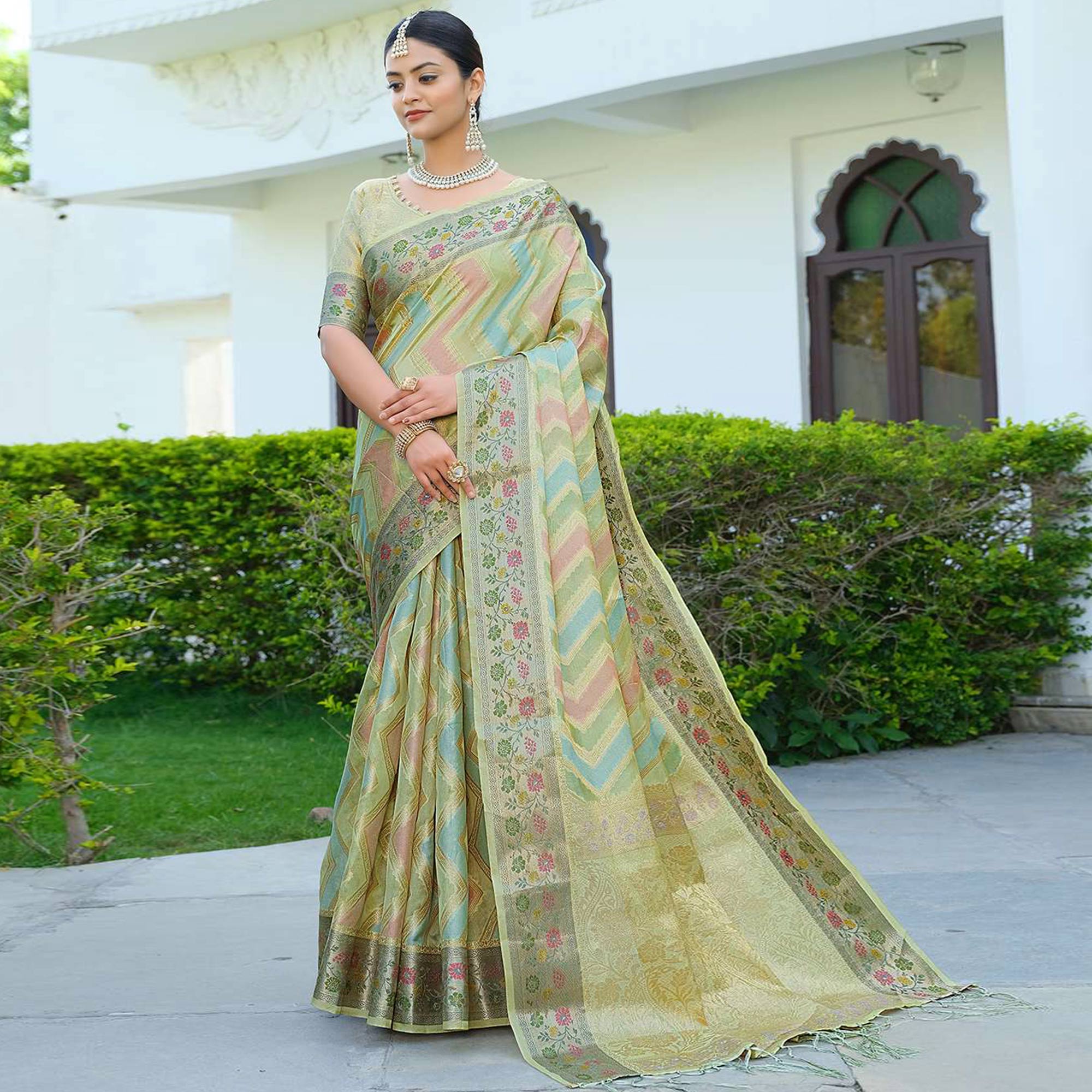 Green Woven Organza Saree With Tassels