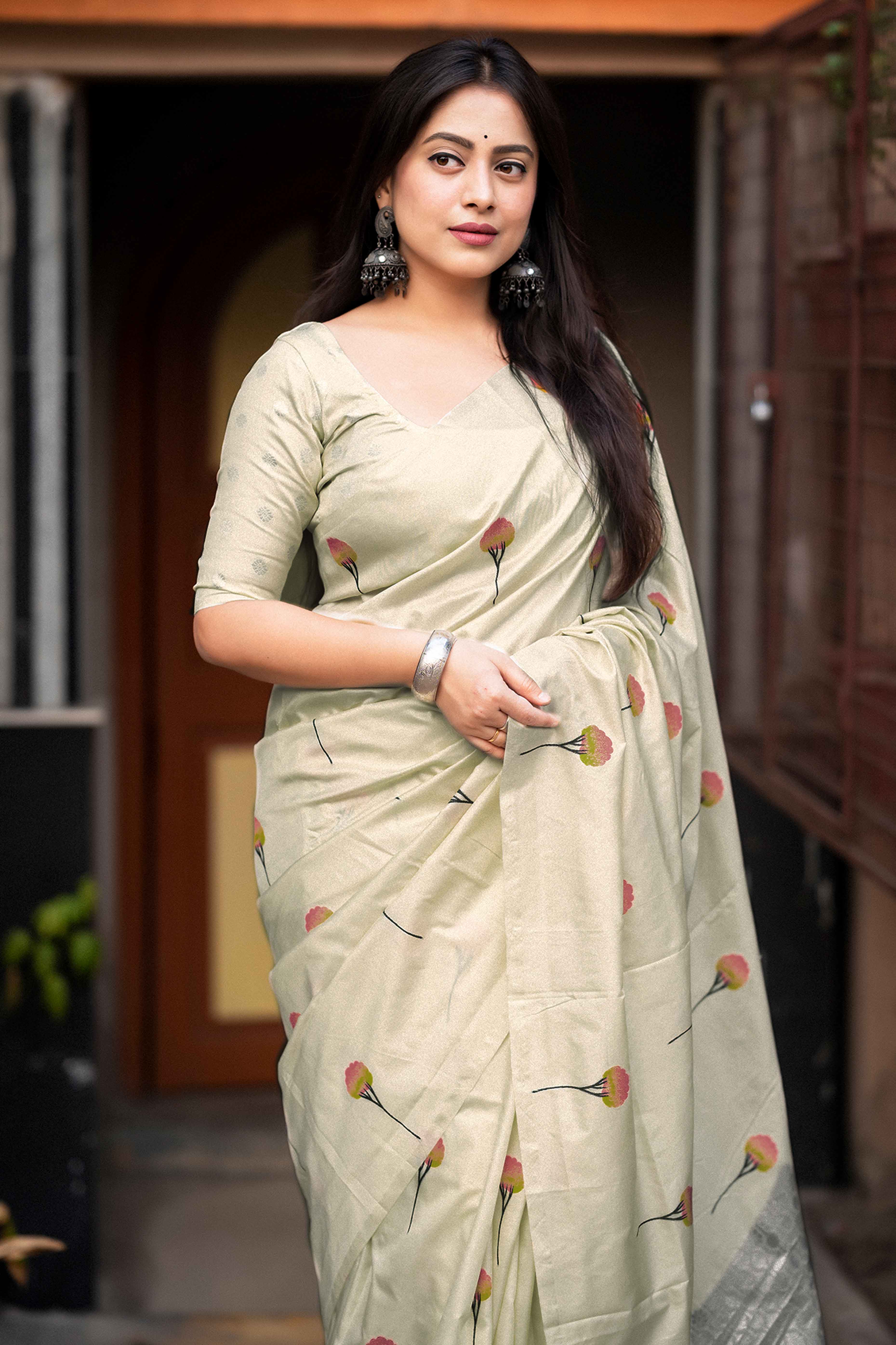 Timeless Cream Banarasi Silk Saree with Floral Zari Weaving & Tassel Border