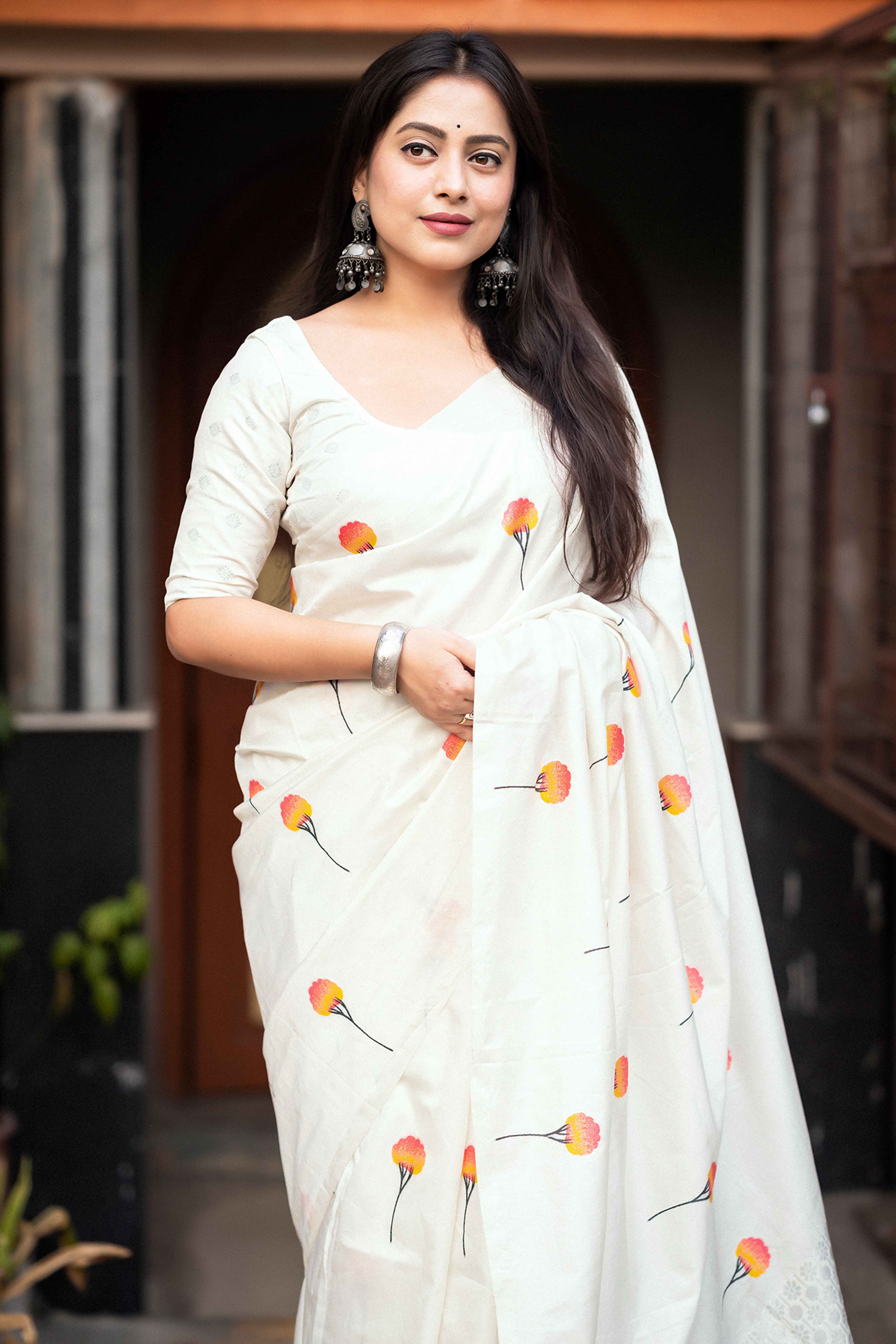 Elegant White Banarasi Silk Saree With Floral Zari Weaving & Tassel Border