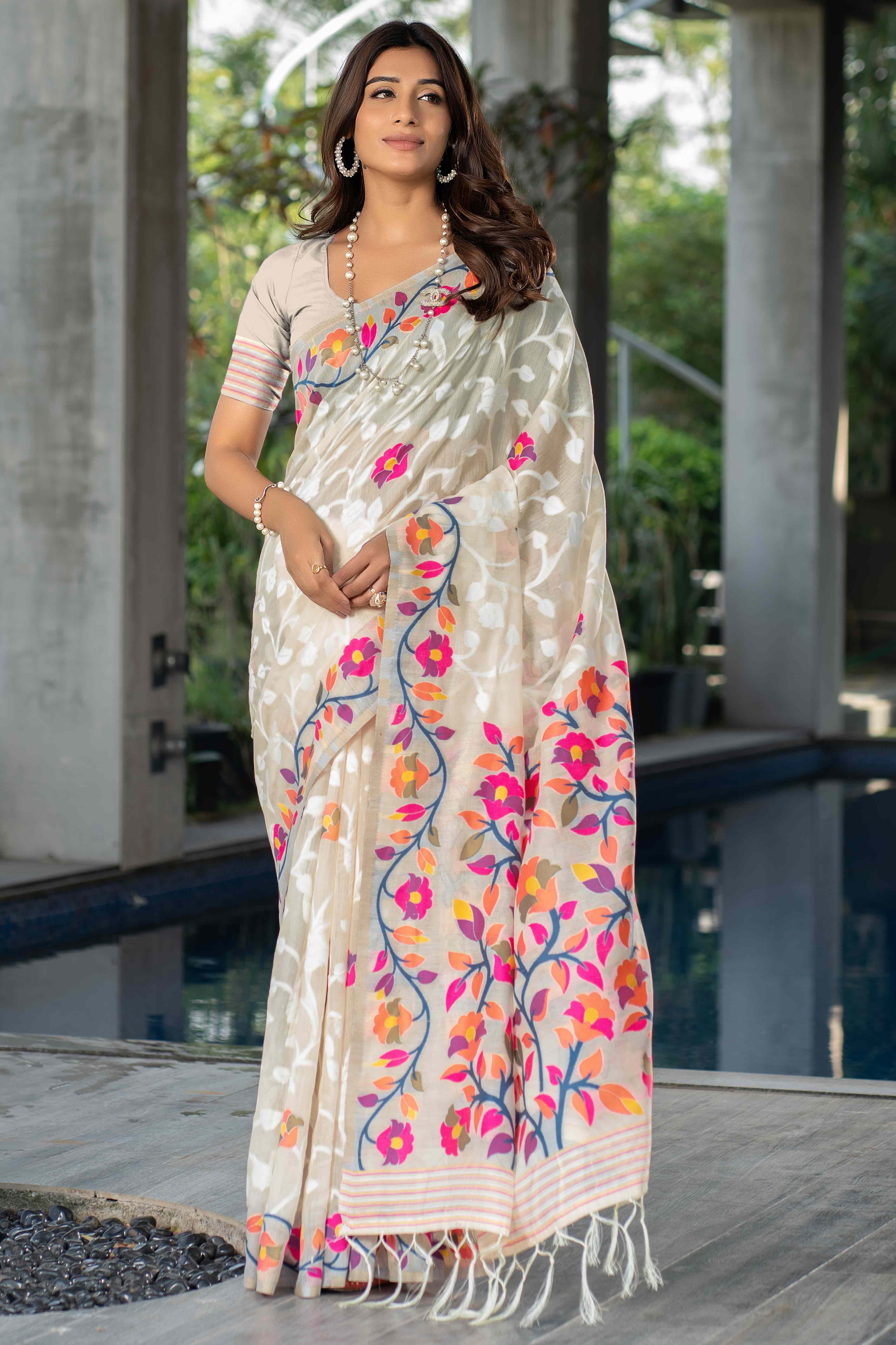 Cream Floral Woven Cotton Jacquard Jamdani Saree With A Graceful Tassel Border
