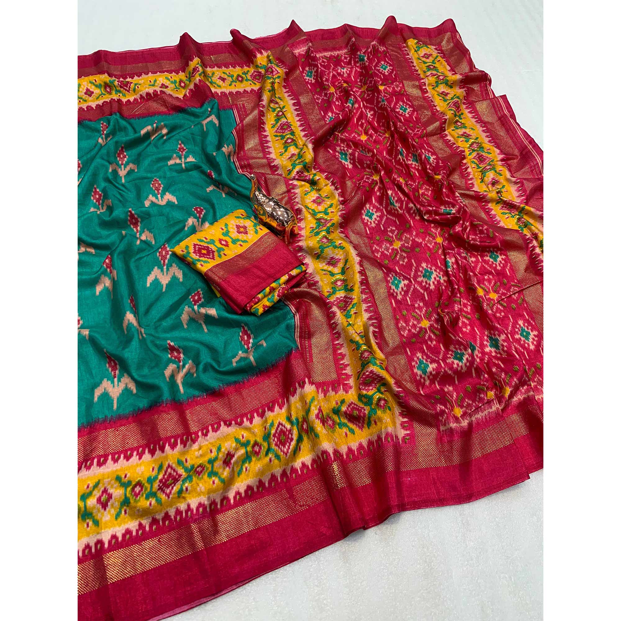 Subtle and Stylish Teal Saree with Ikkat Prints in Luxe Dola Silk for Festive Wear