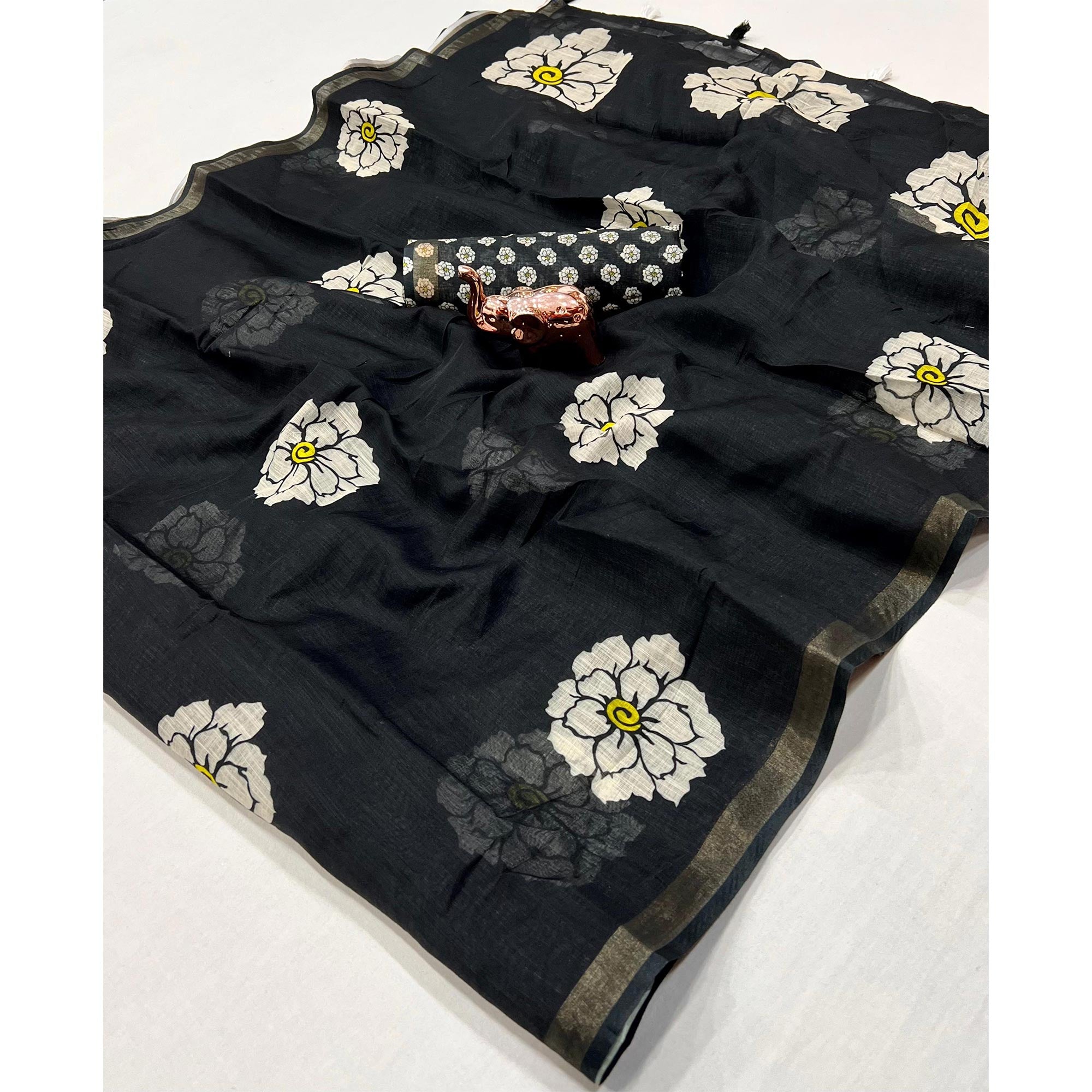 Graceful Black Floral Printed Saree in Linen Silk with Delicate Tassel Accents