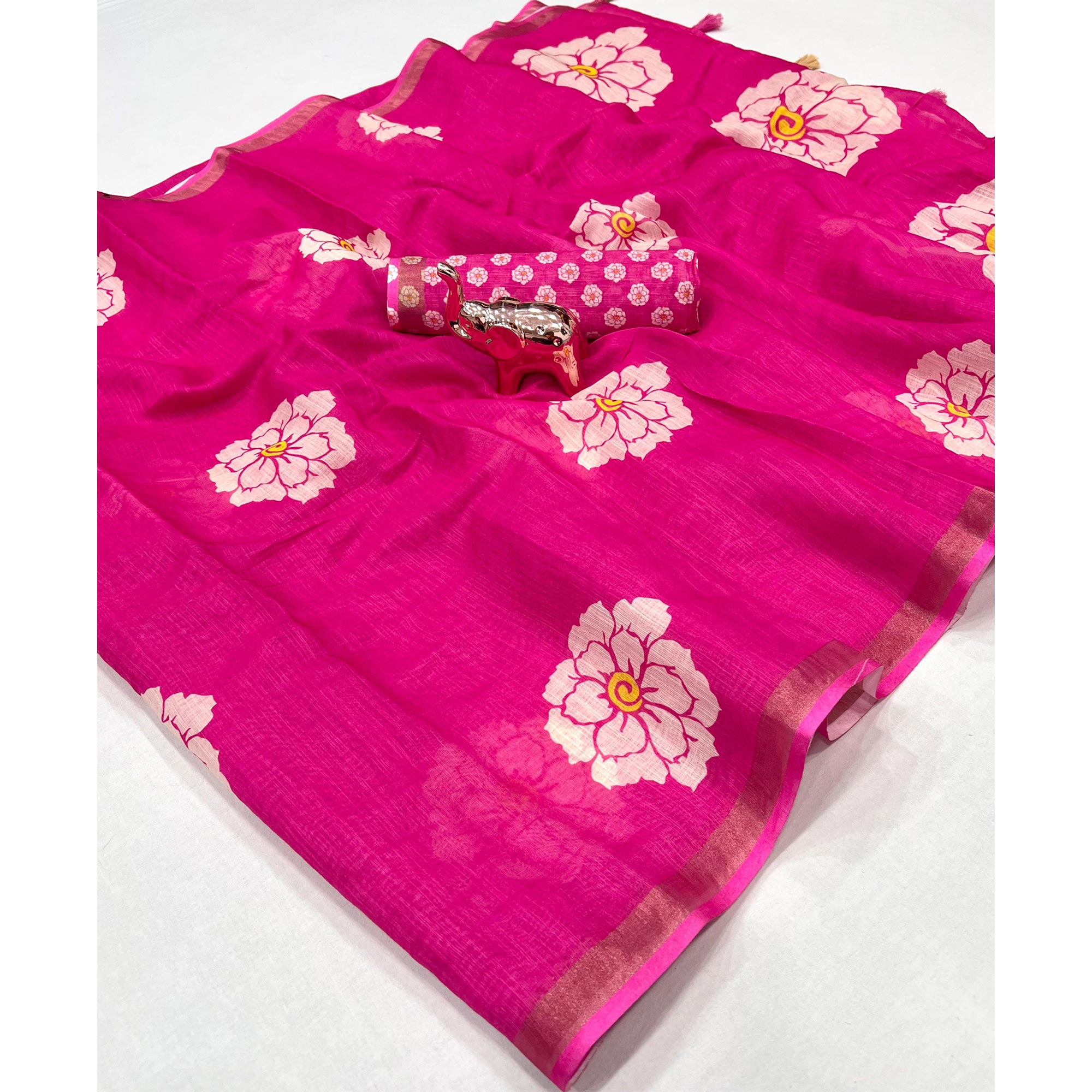 Graceful Rani Pink Floral Printed Saree in Linen Silk with Delicate Tassel Accents