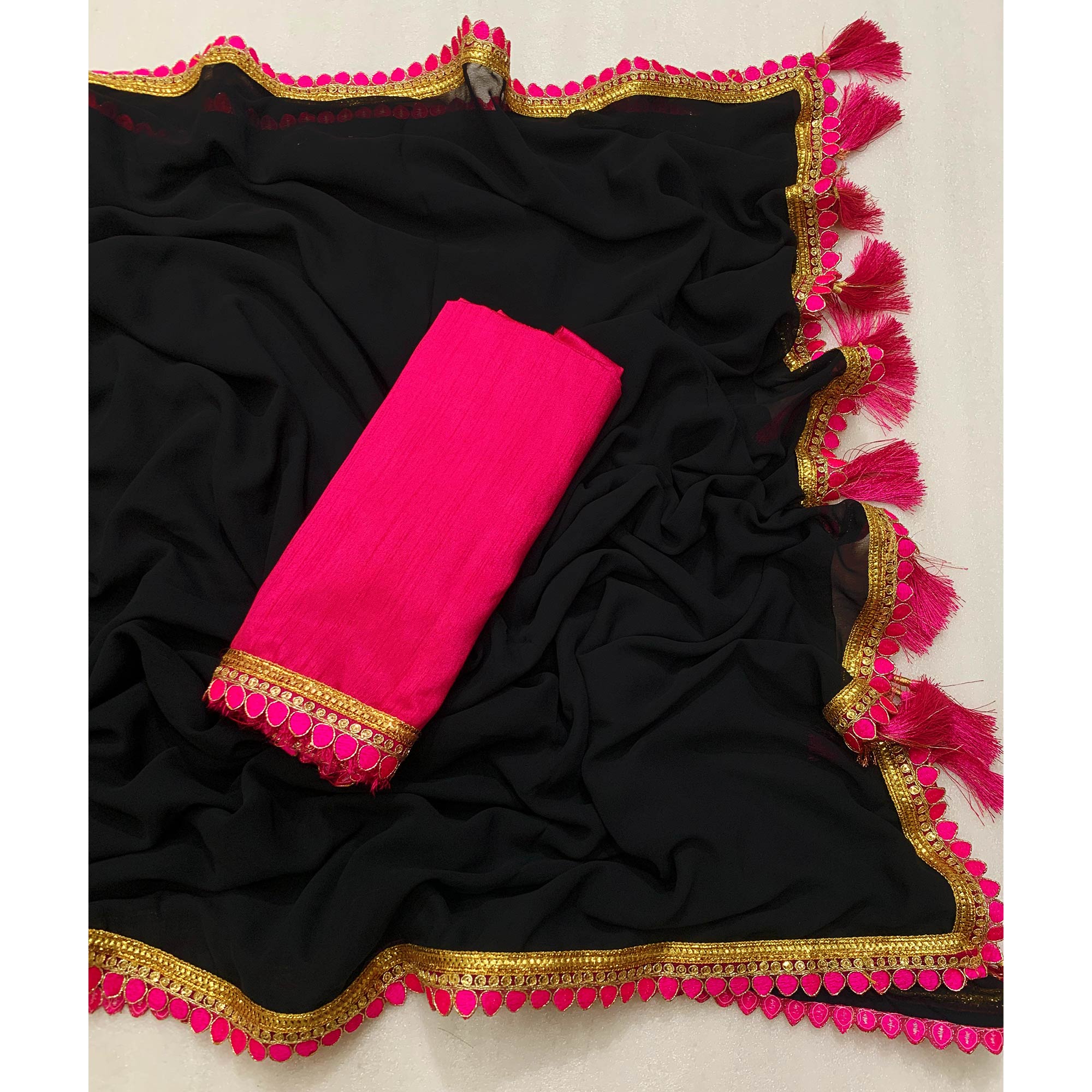 Black Solid Georgette Saree With Embroidered Lace Border Tassels