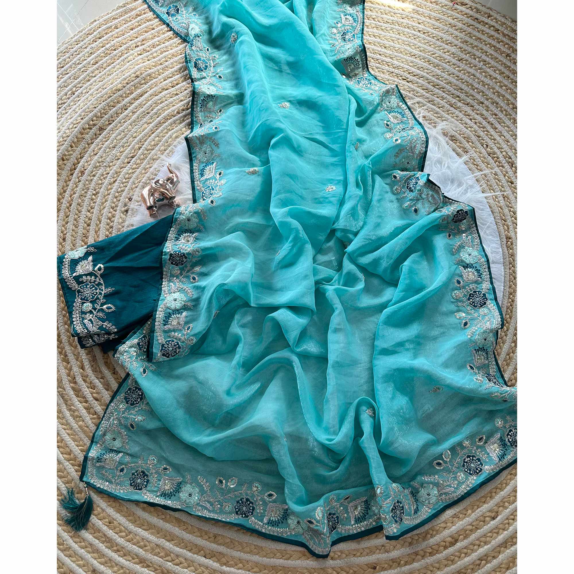 Blue Pure Silk Saree Showcasing Floral Sequins Embroidery With A Decorative Tassel Pallu