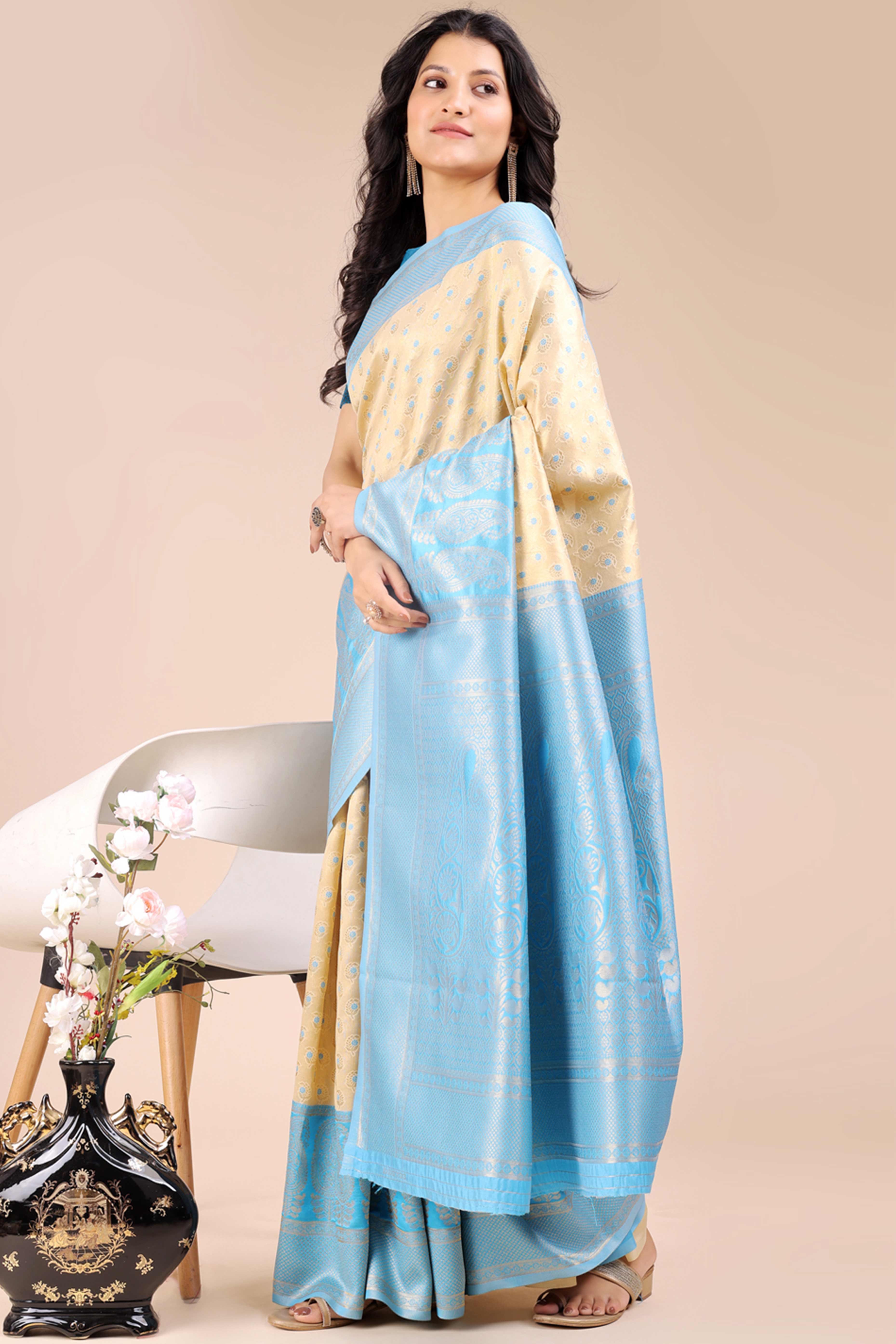 Cream Banarasi Silk Saree Featuring Lustrous Sky Blue Floral Zari Weaving and a Rich Contrast Border