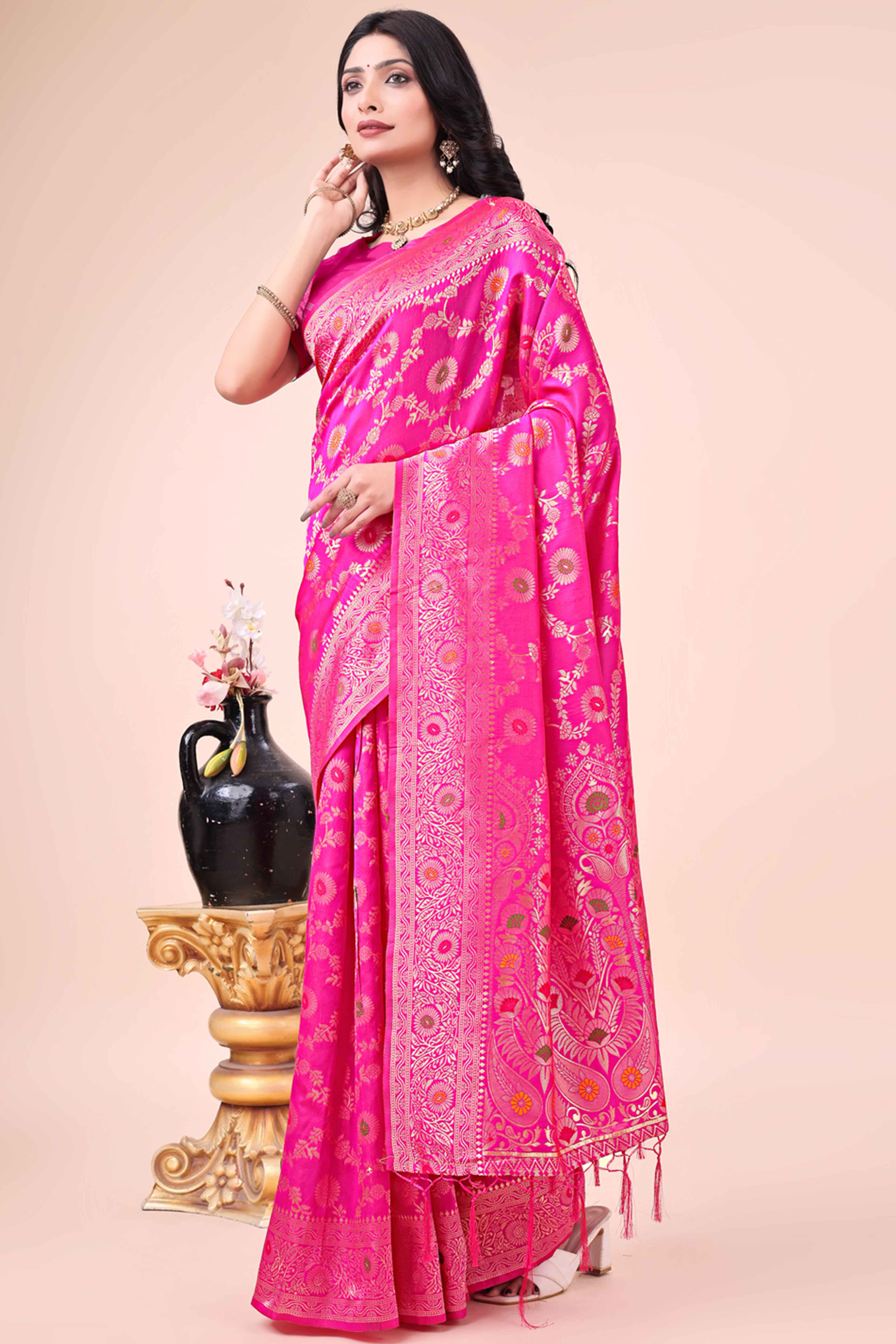 Rani Pink Banarasi Silk Saree With Intricate Floral Weave & Elegant Tassel Accents
