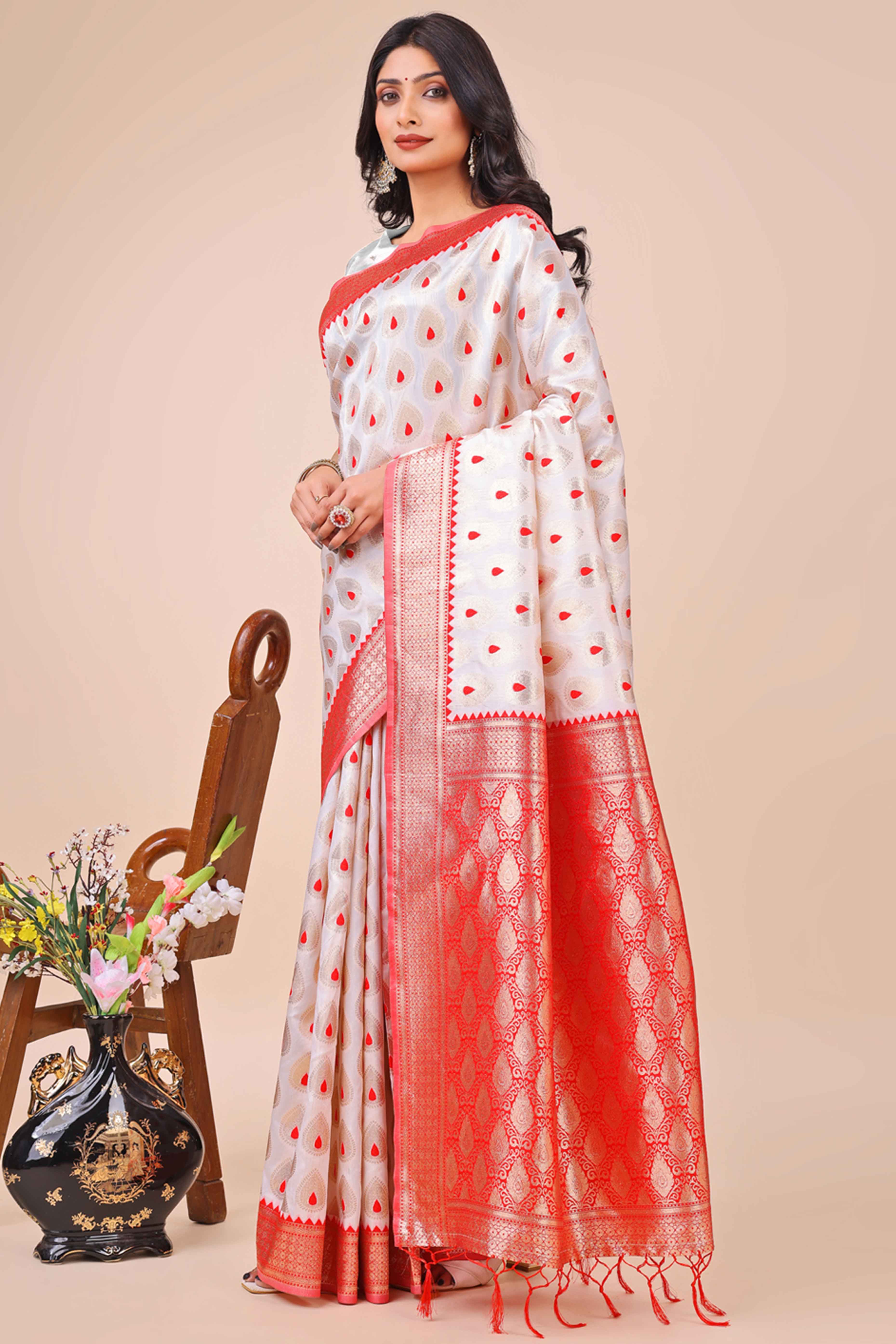 White Banarasi Silk Saree With Intricate Floral Weave & Elegant Tassel Accents