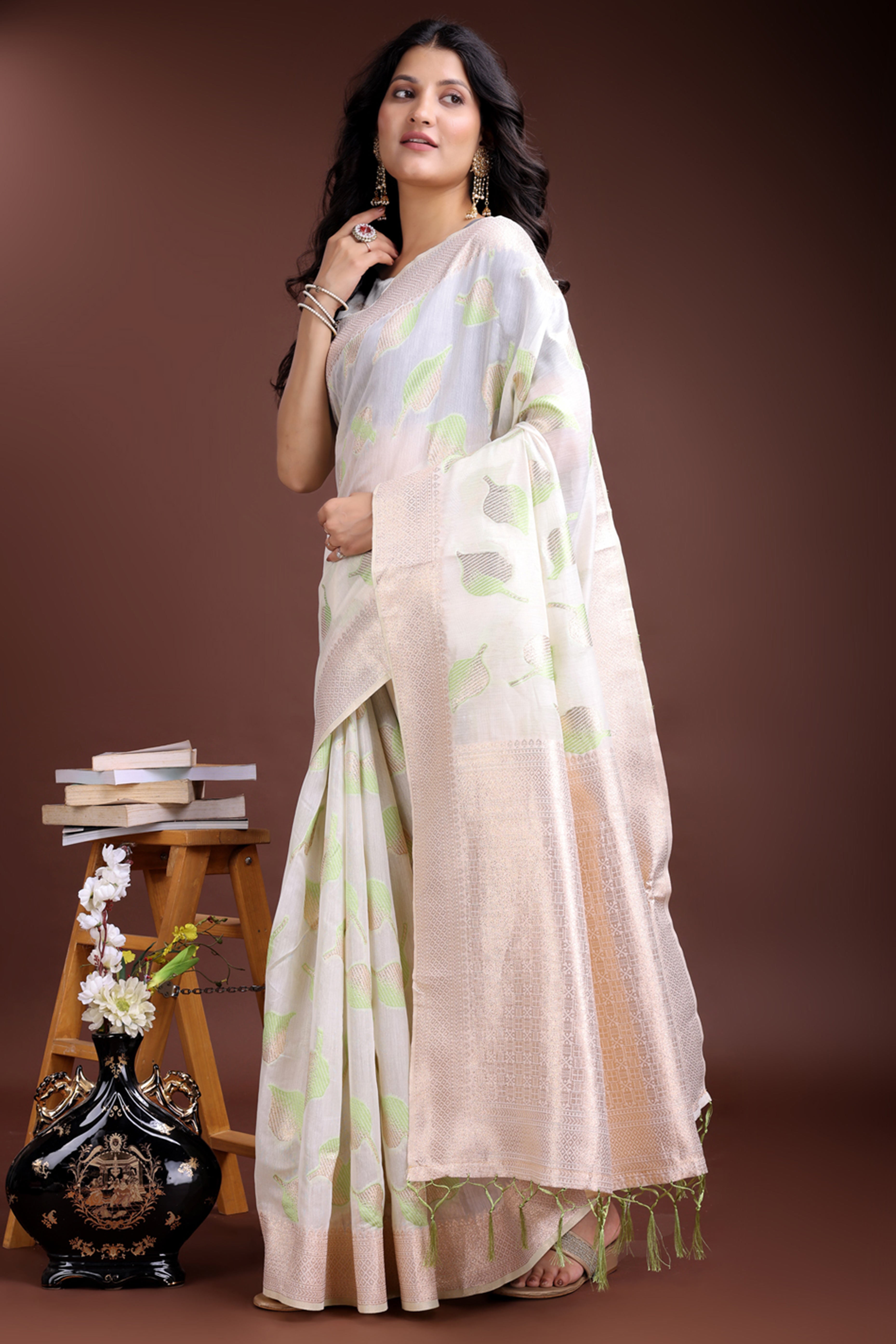 White and Light Green Cotton Silk Saree with Leaf Motifs and Zari Border Tassels
