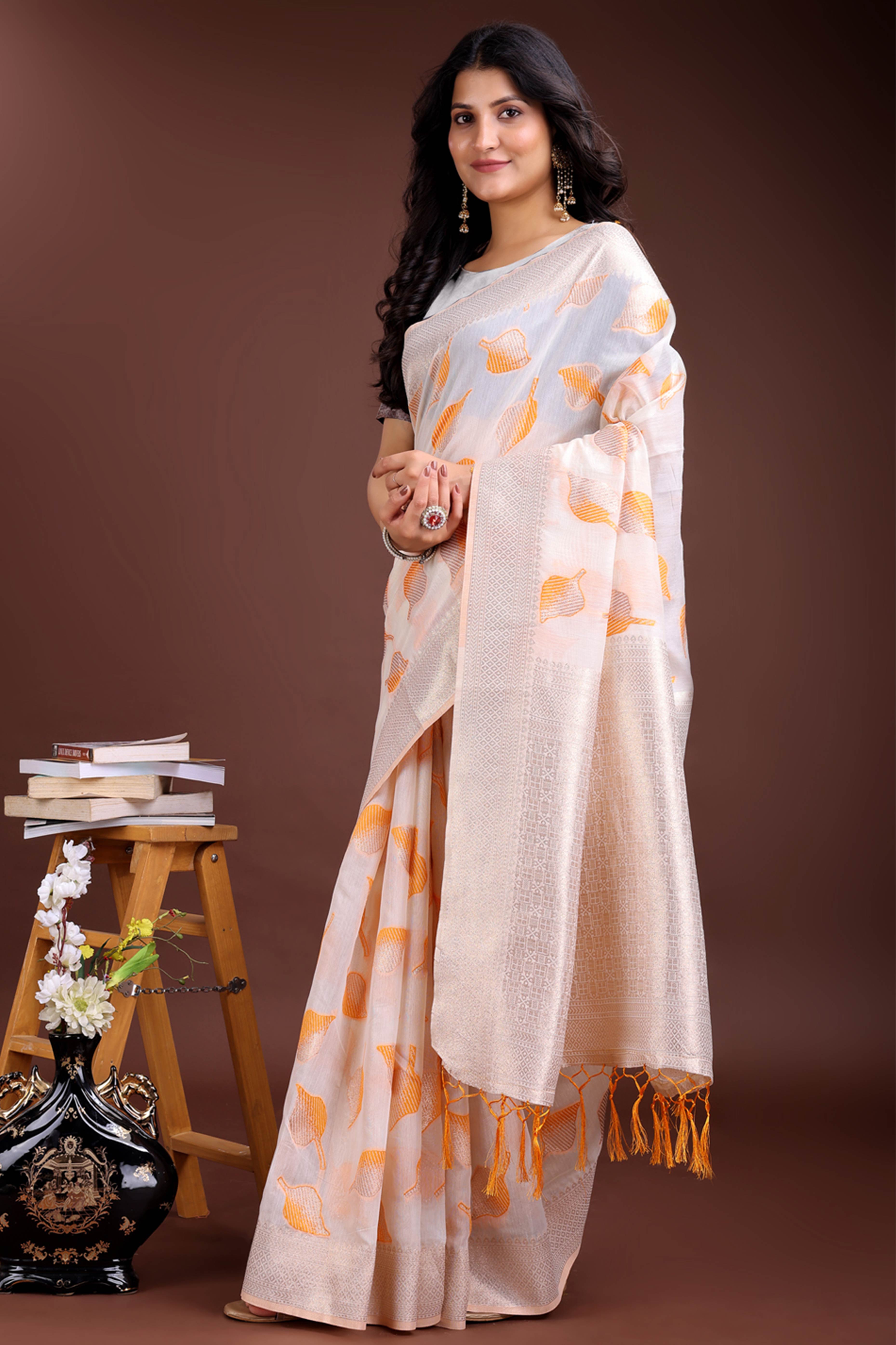 White and Orange Cotton Silk Saree with Leaf Motifs and Zari Border Tassel Style