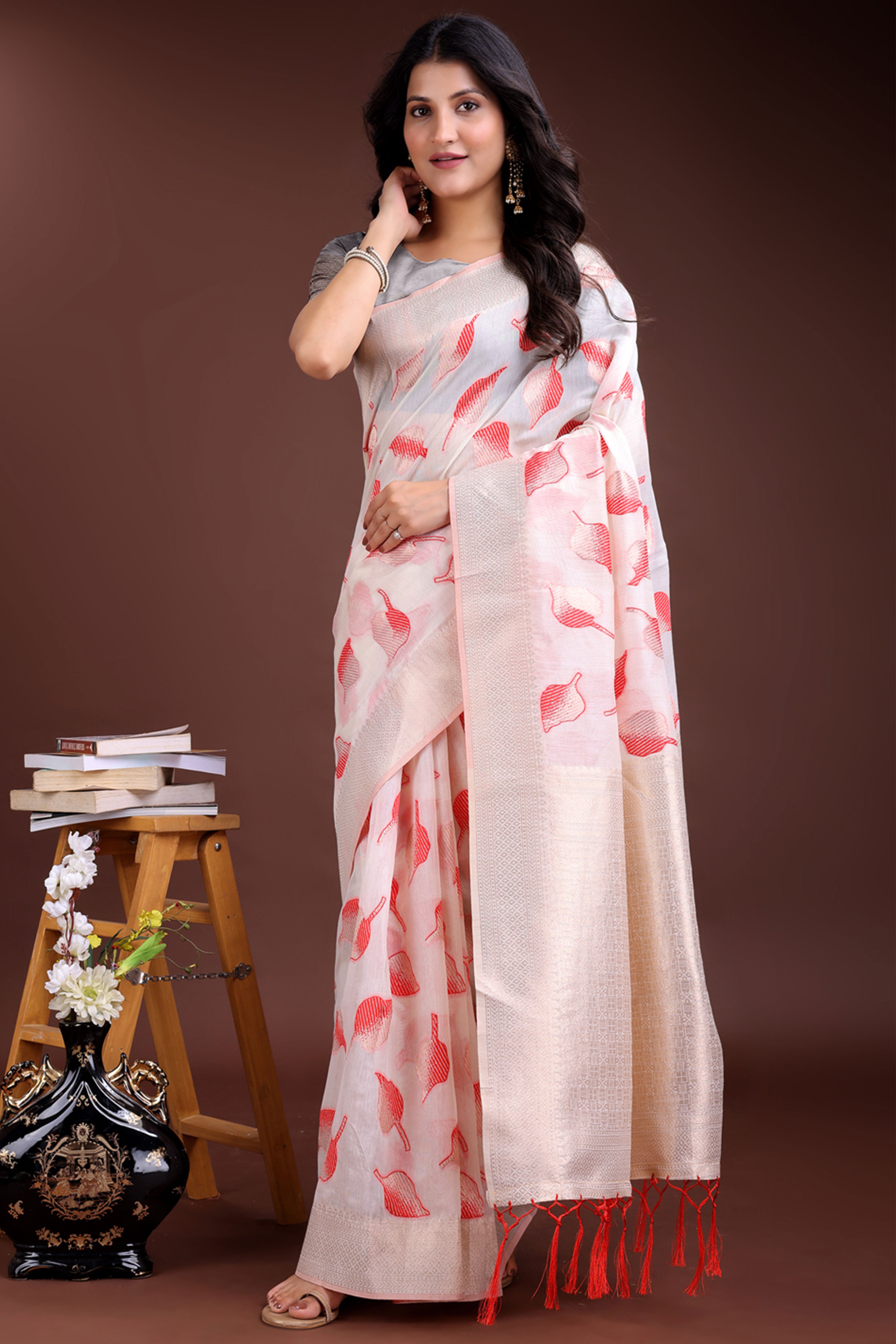 White and Red Cotton Silk Saree with Leaf Motifs and Zari Border Tassel Artistry