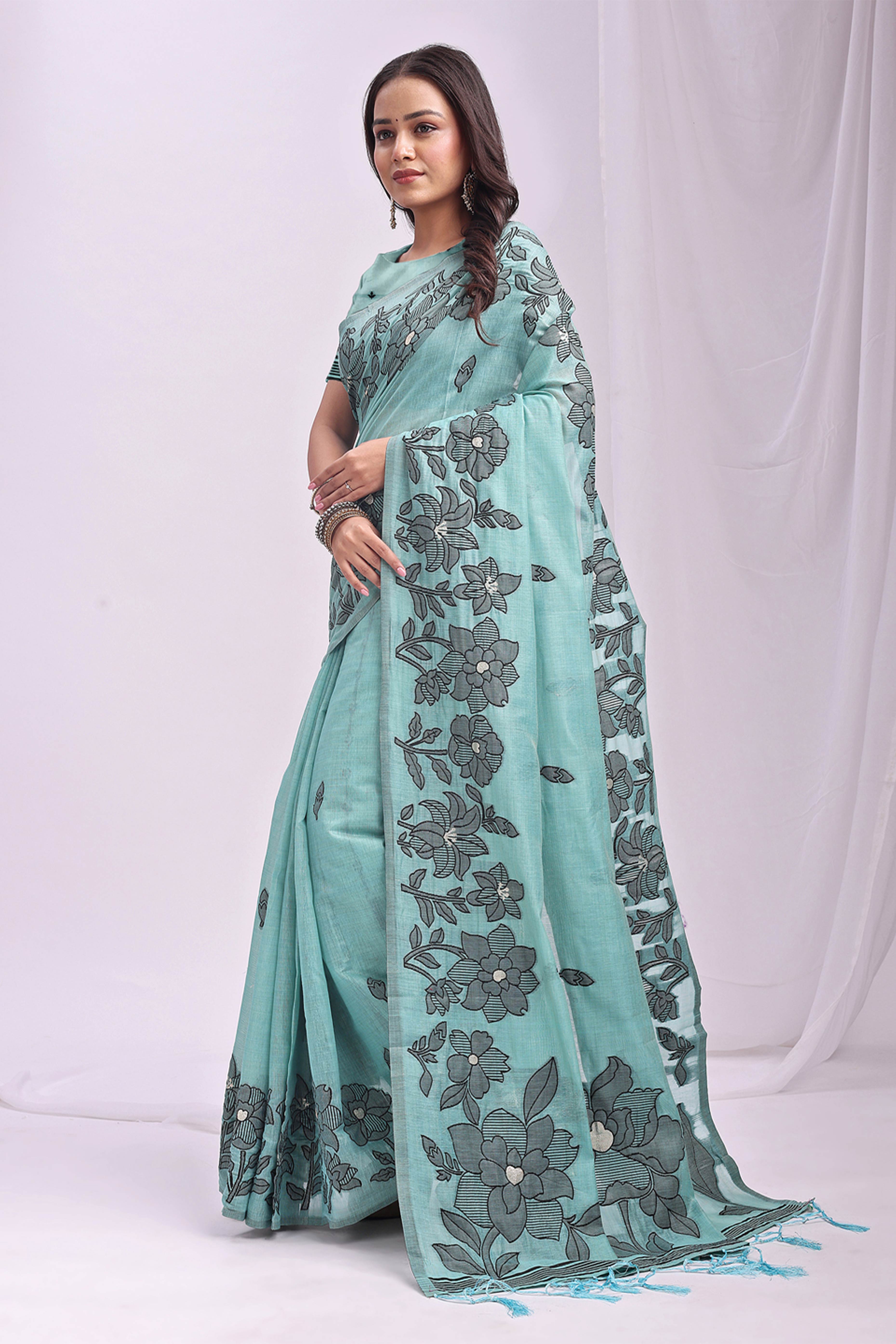 Sea Green Ethnic Saree in a Linen Cotton Blend Adorned with Floral Weave Designs