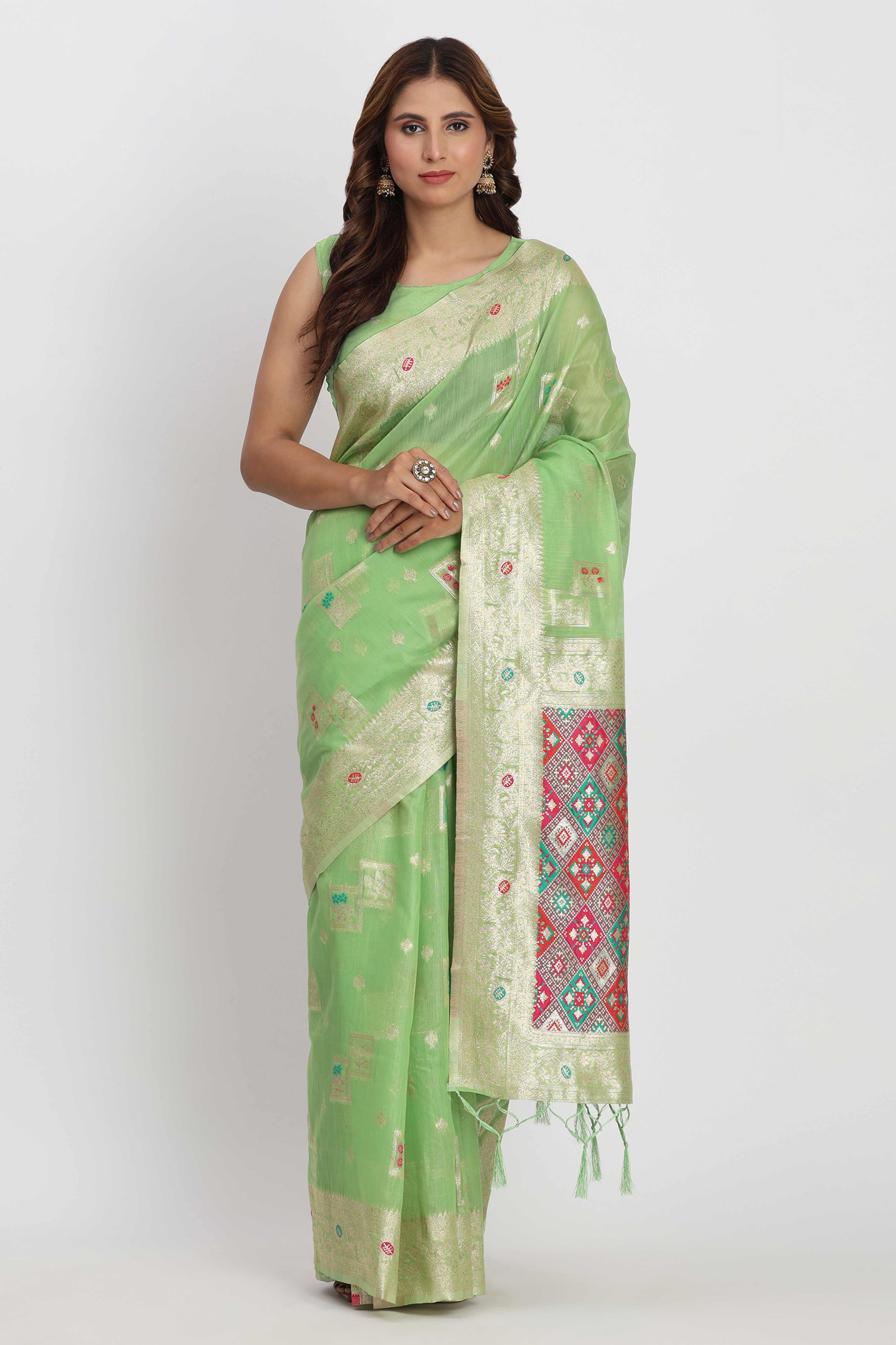 Floral Zari Weaving Brings Regal Beauty To This Light Green Linen Cotton Saree With Tassel Accents