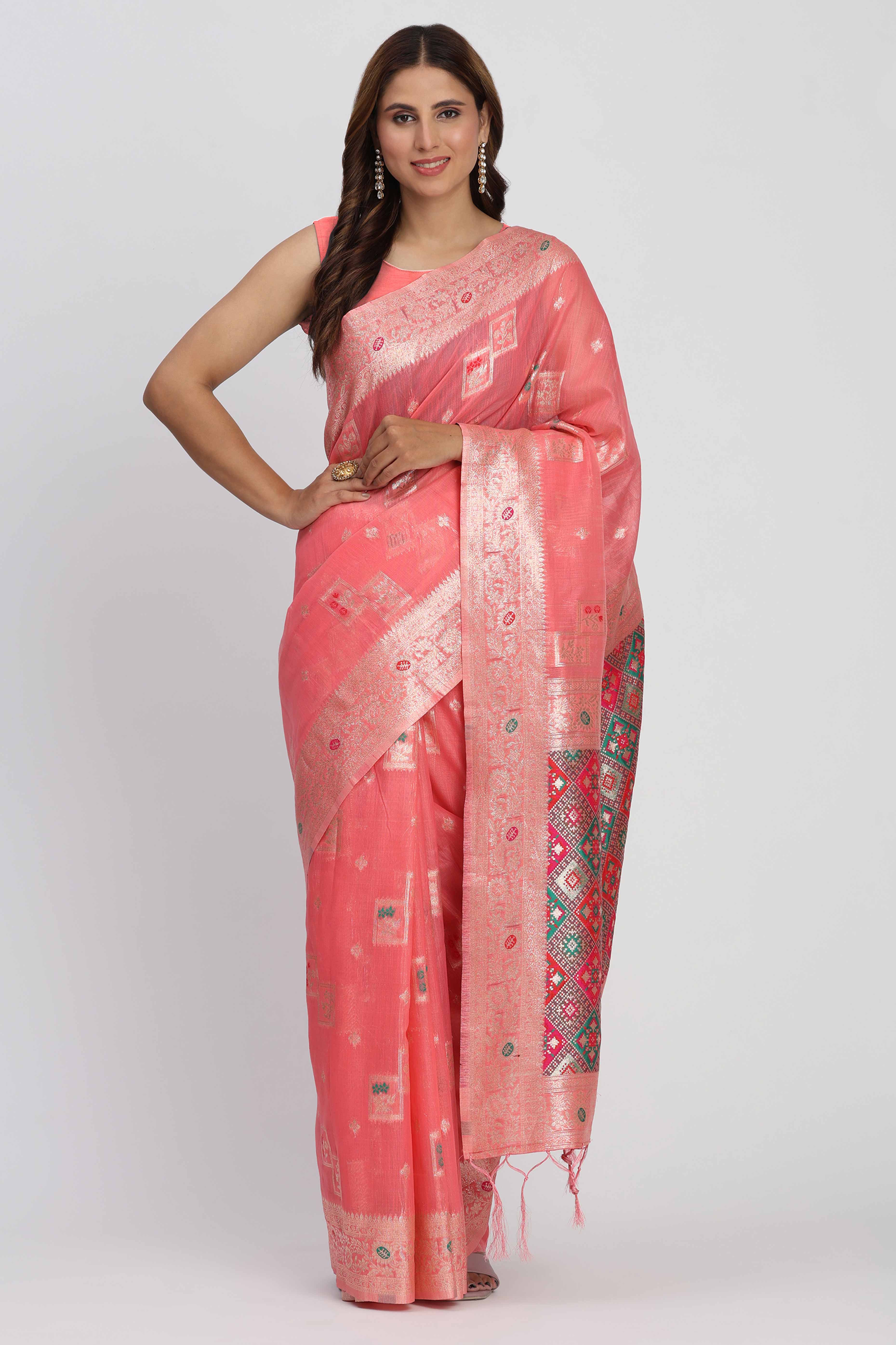 Floral Zari Weaving Brings Regal Beauty To This Coral Pink Linen Cotton Saree With Tassel Accents