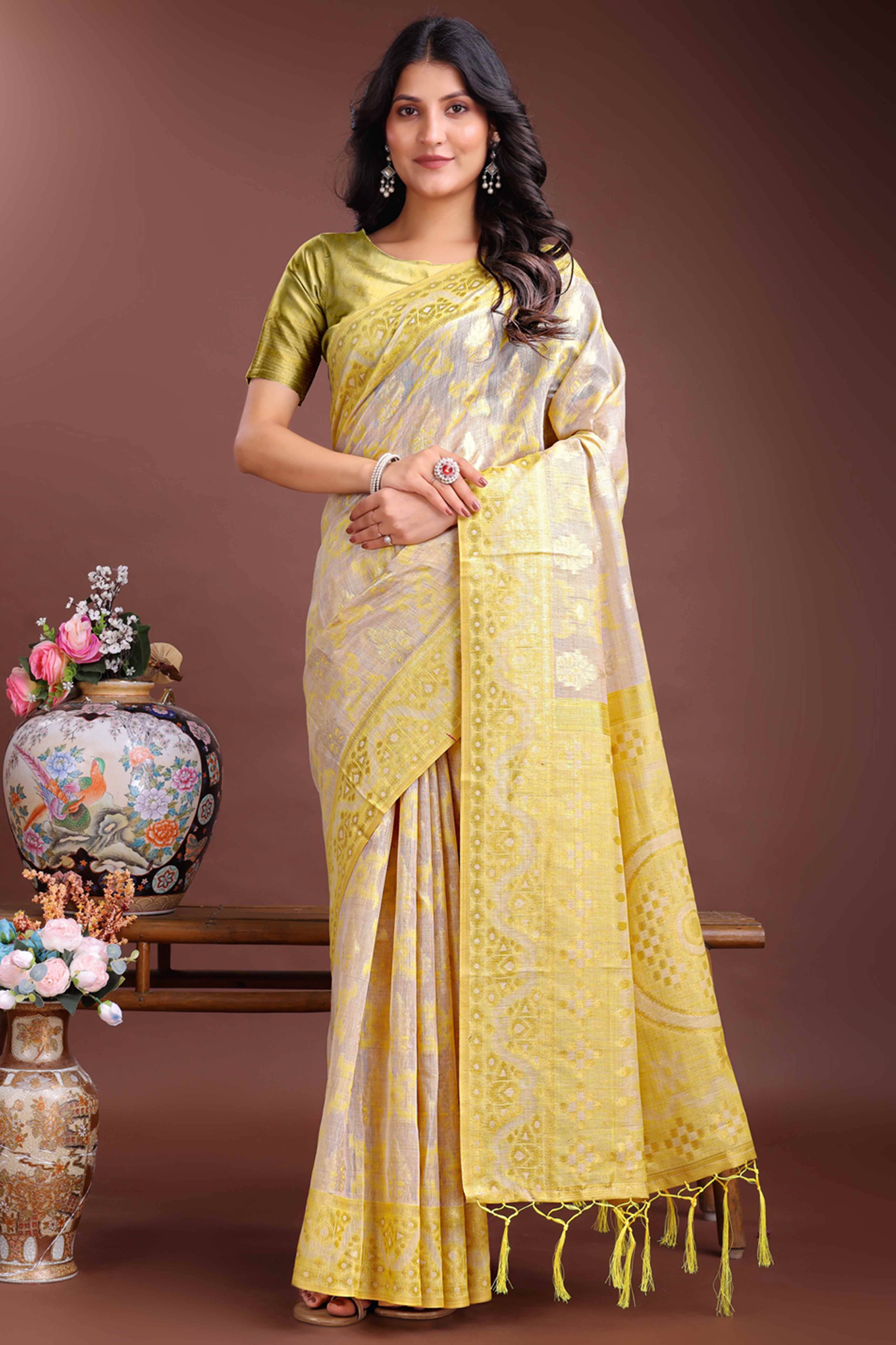 Radiant Yellow Traditional Ikkat Style Zari Weaving Cotton Blend Saree with Vibrant Tassel Embellishments