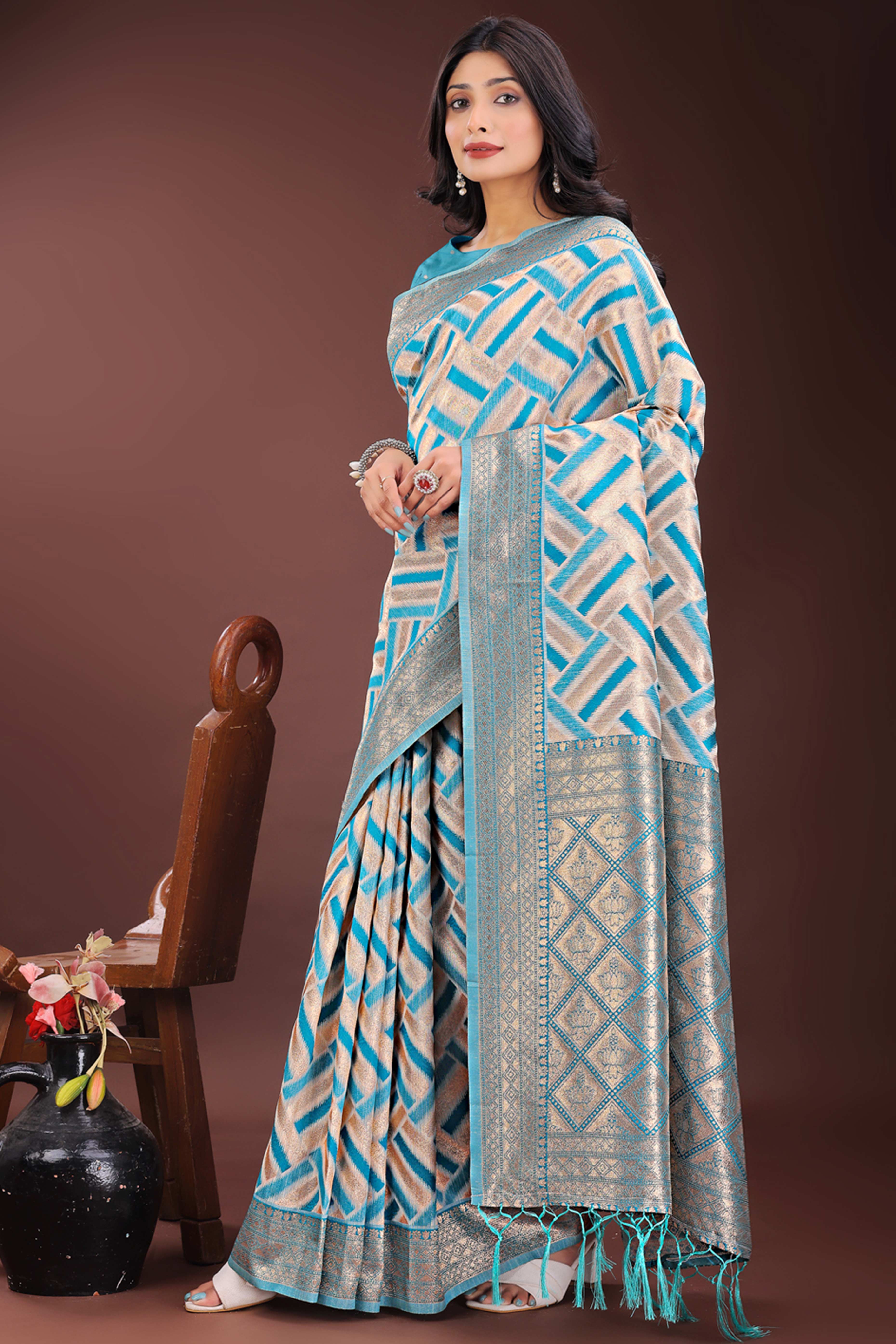 Teal Saree with Zari Woven Geometric Motifs and Graceful Tassel Accents