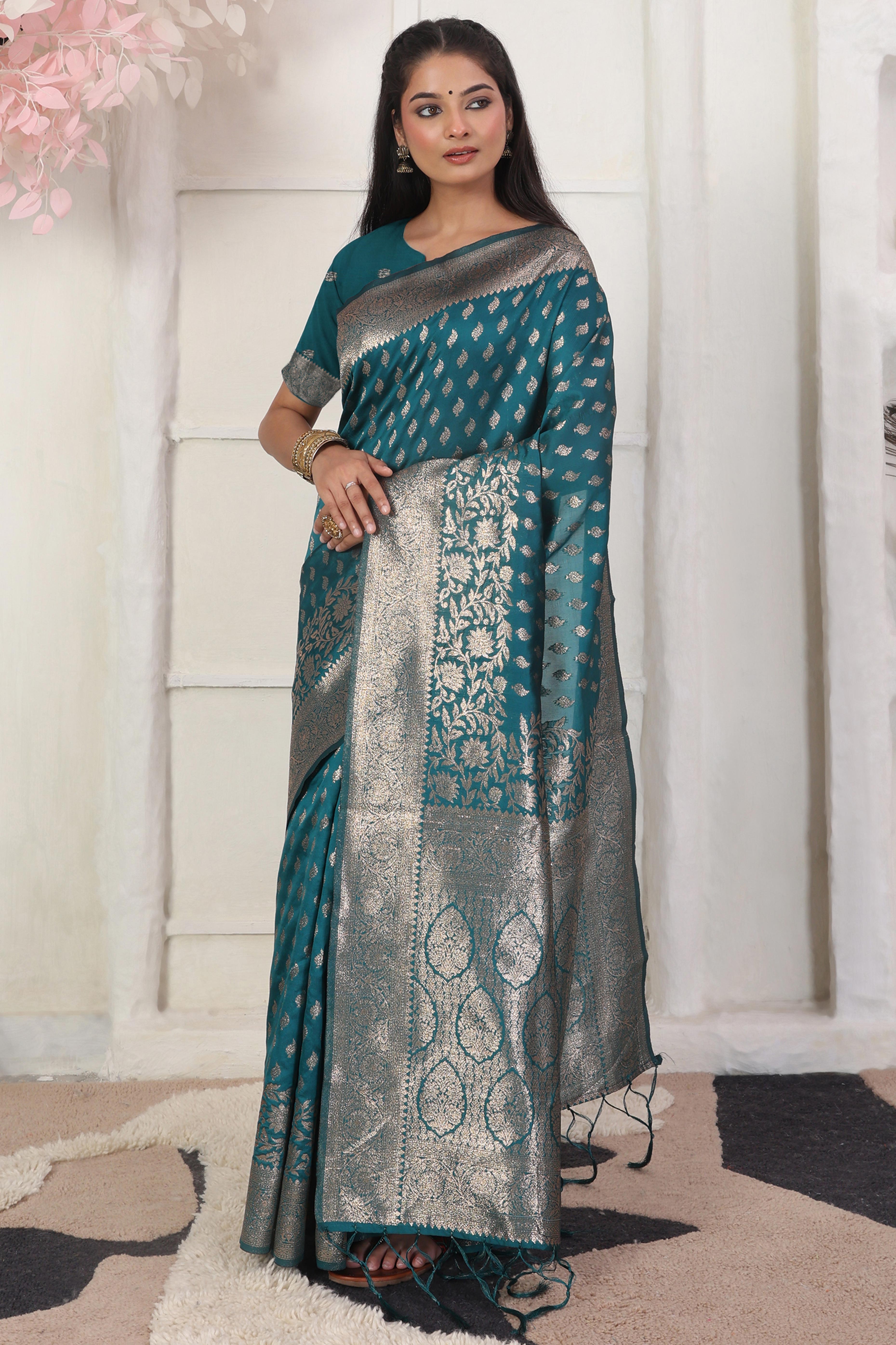 Rama Blue Traditional Lichi Silk Blend Saree Enhanced With Floral Zari Weaving & Tassel Pallu