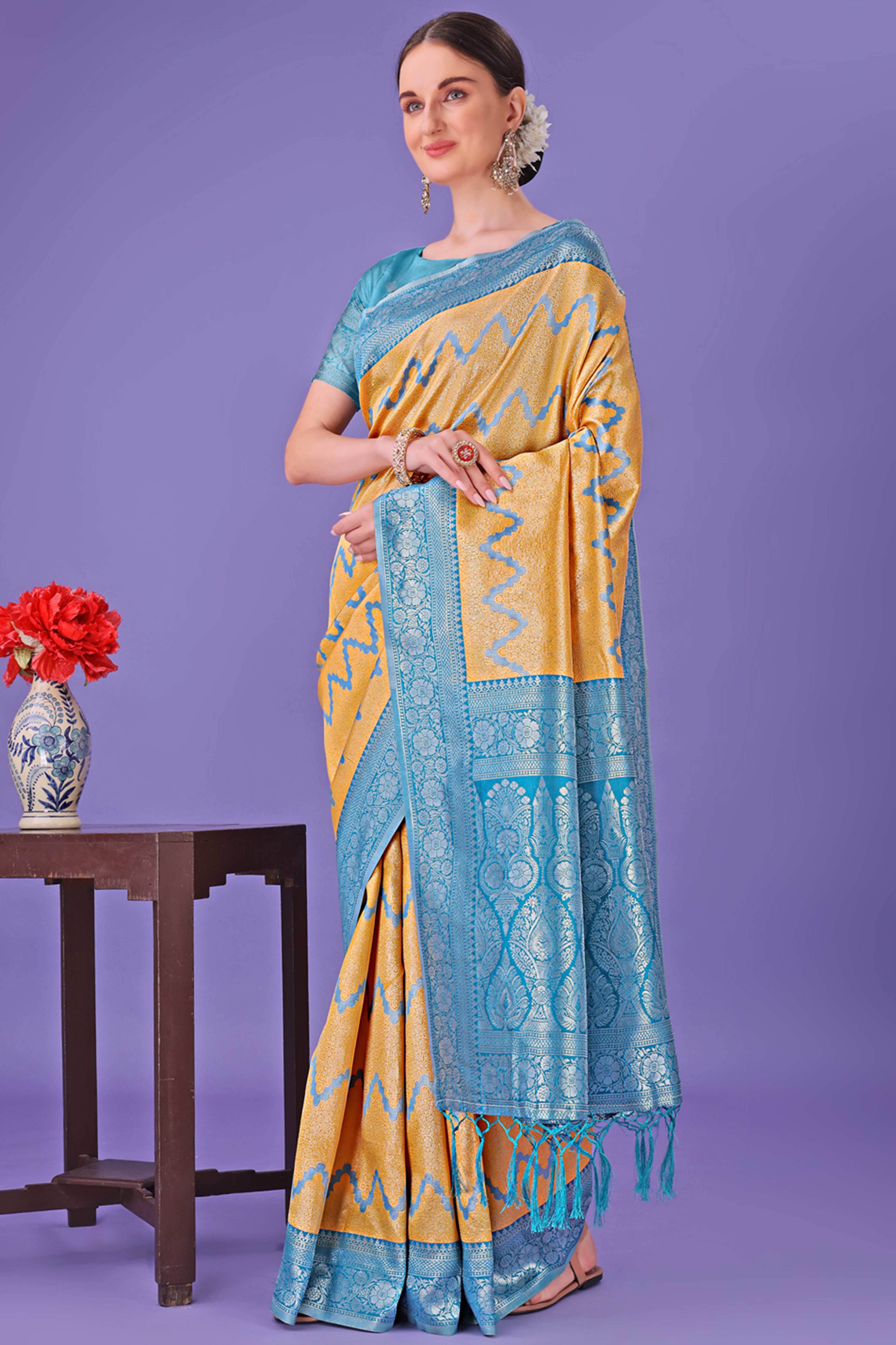 Yellow Lichi Cotton Silk Saree Adorned With Floral Zari Weave & Tassels