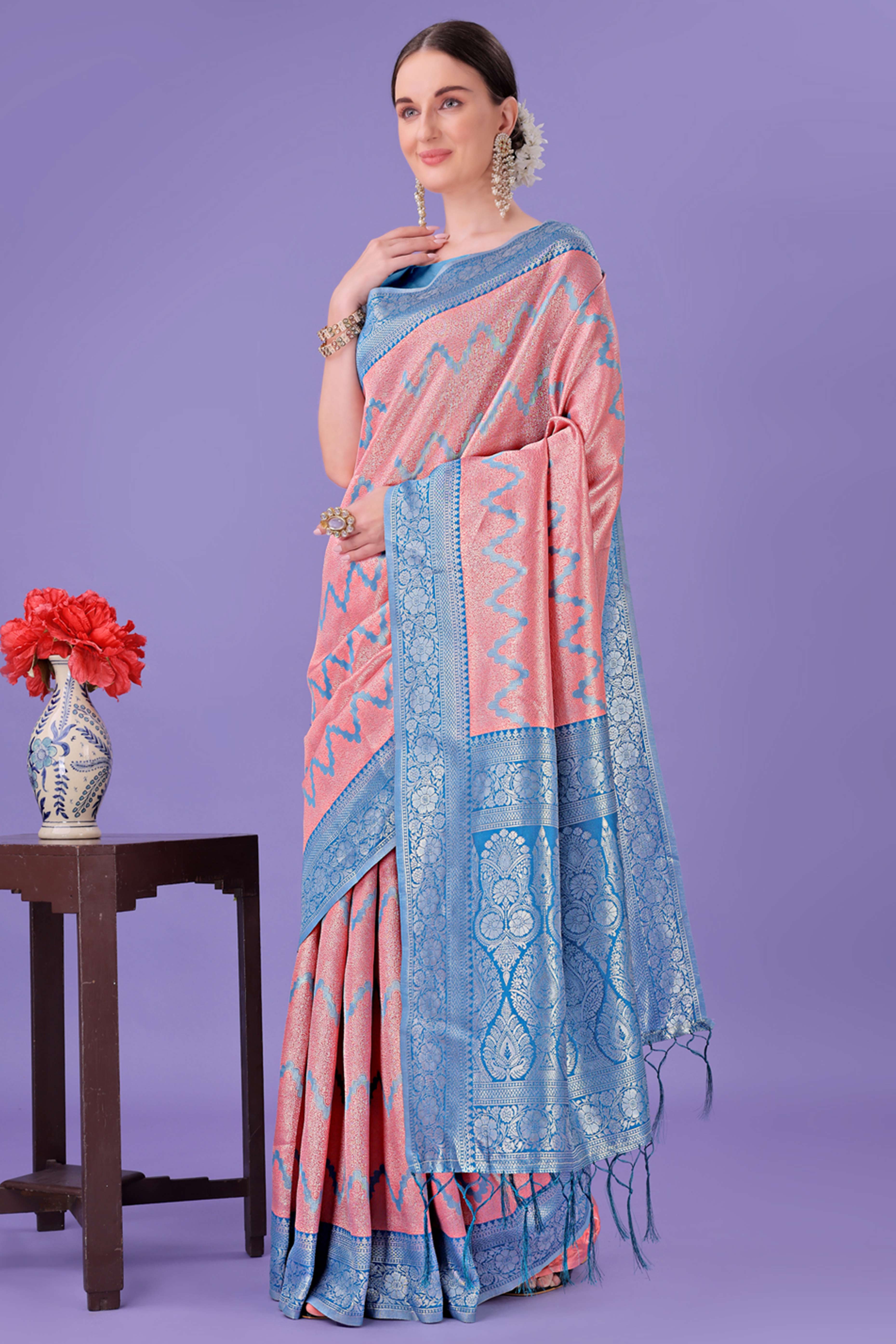 Peach Lichi Cotton Silk Saree Adorned With Floral Zari Weave & Tassels