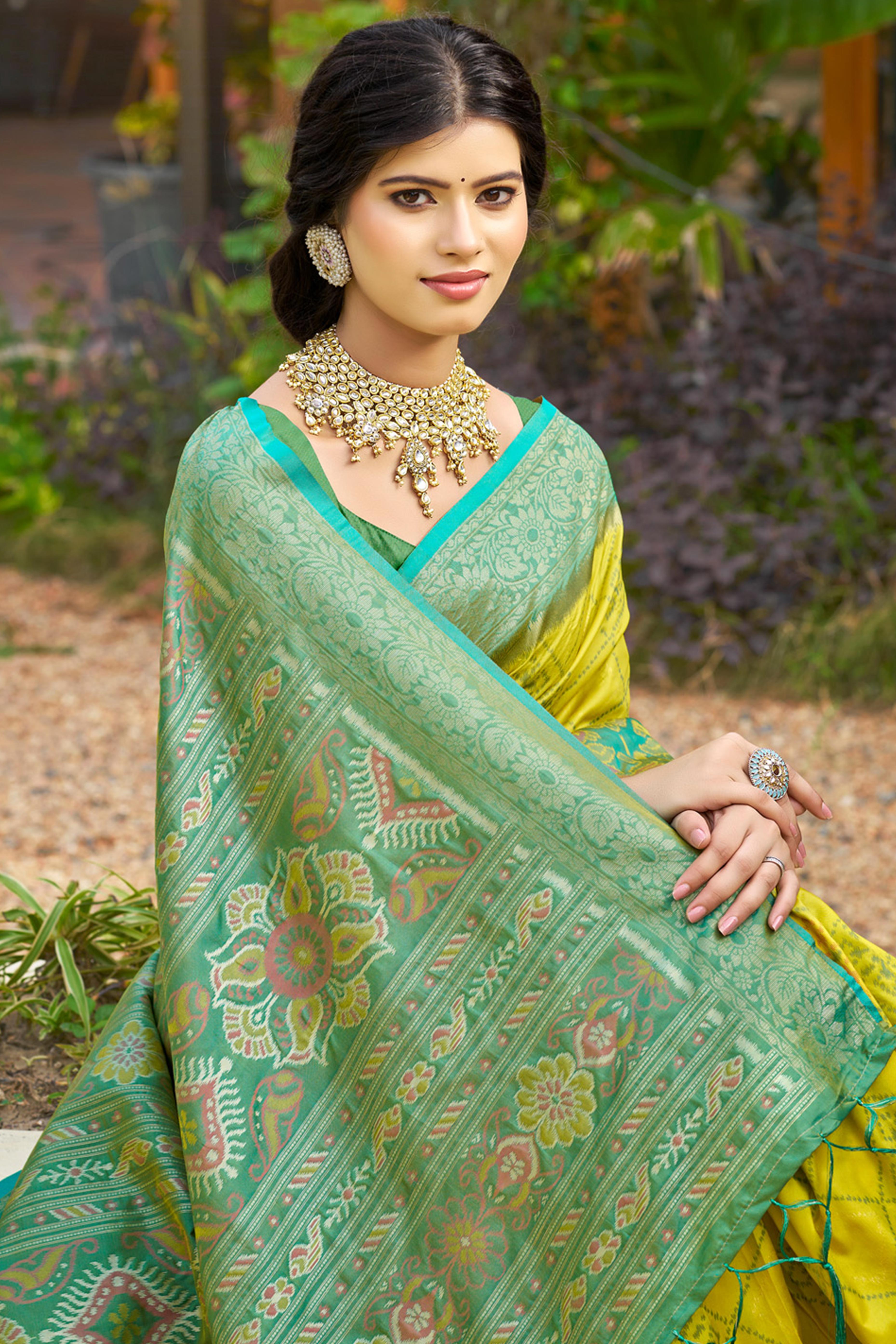 Graceful Lemon Yellow Pochampally Silk Blend Saree Adorned With Floral Weaving & Tassel Pallu
