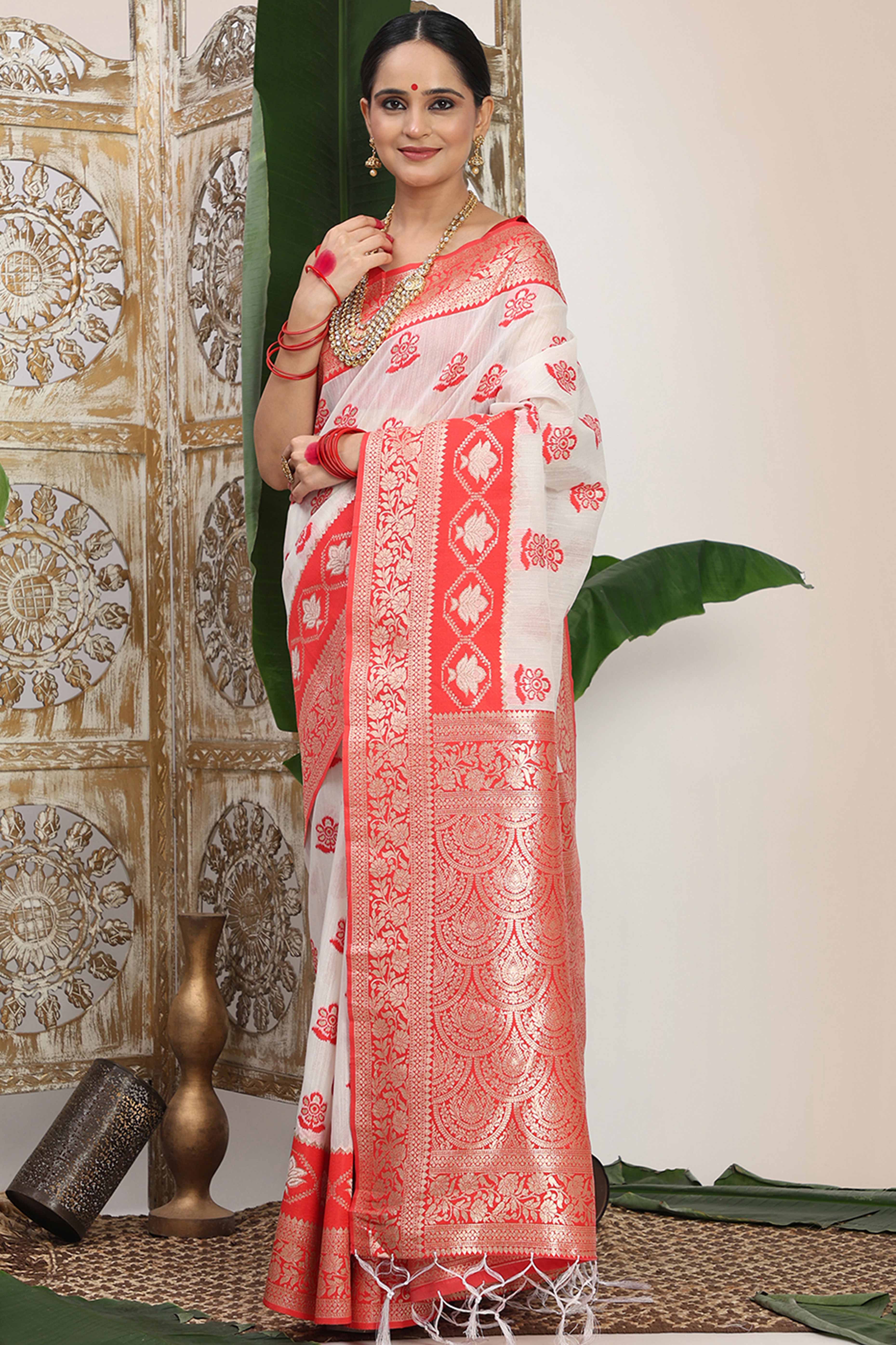 Chic White & Red  Saree In Linen Cotton Flaunting Traditional Zari Weaving And A Tasselled Edge