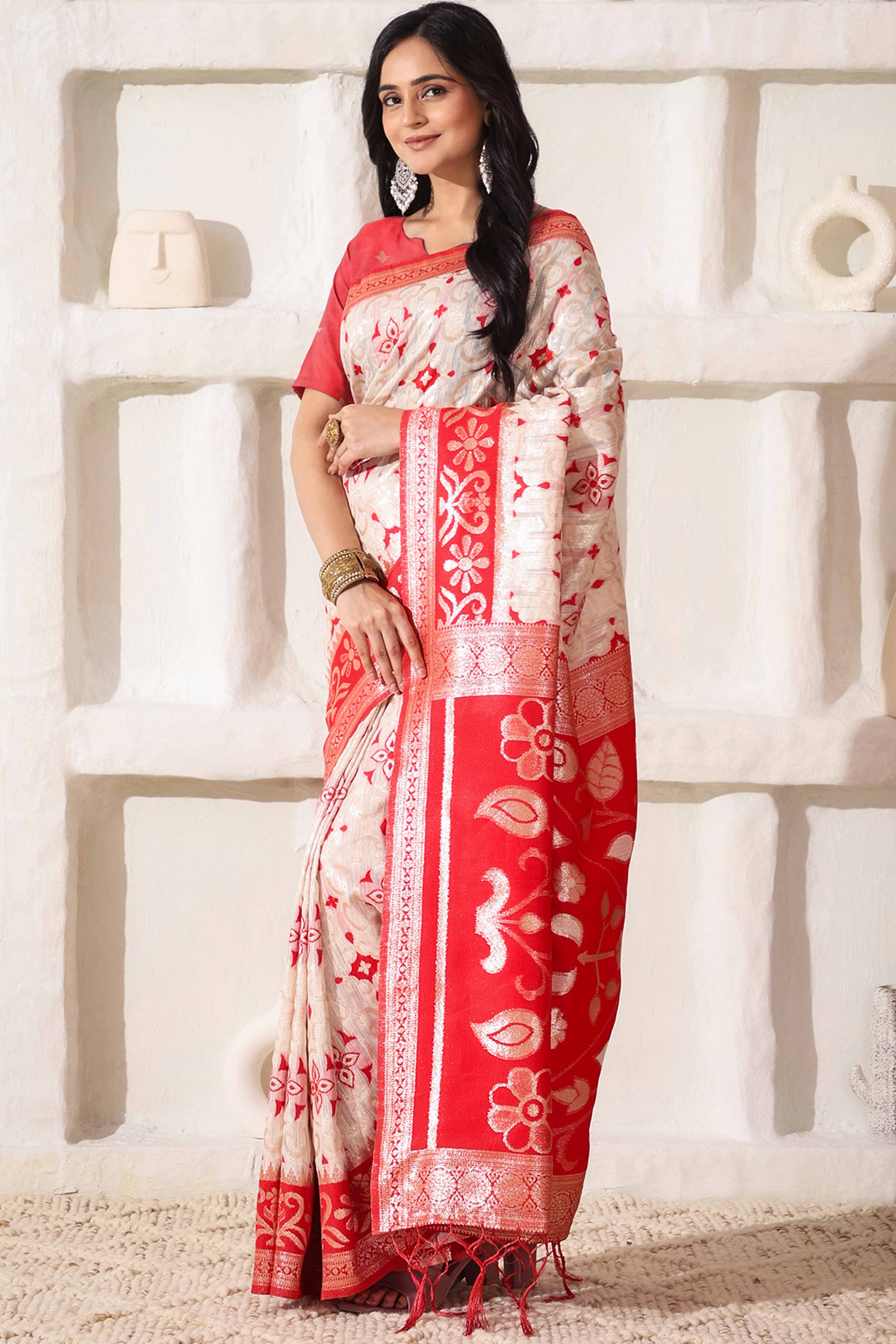 White & Red Linen Cotton Saree Adorned With Intricate Zari Weaving And Tassel Pallu