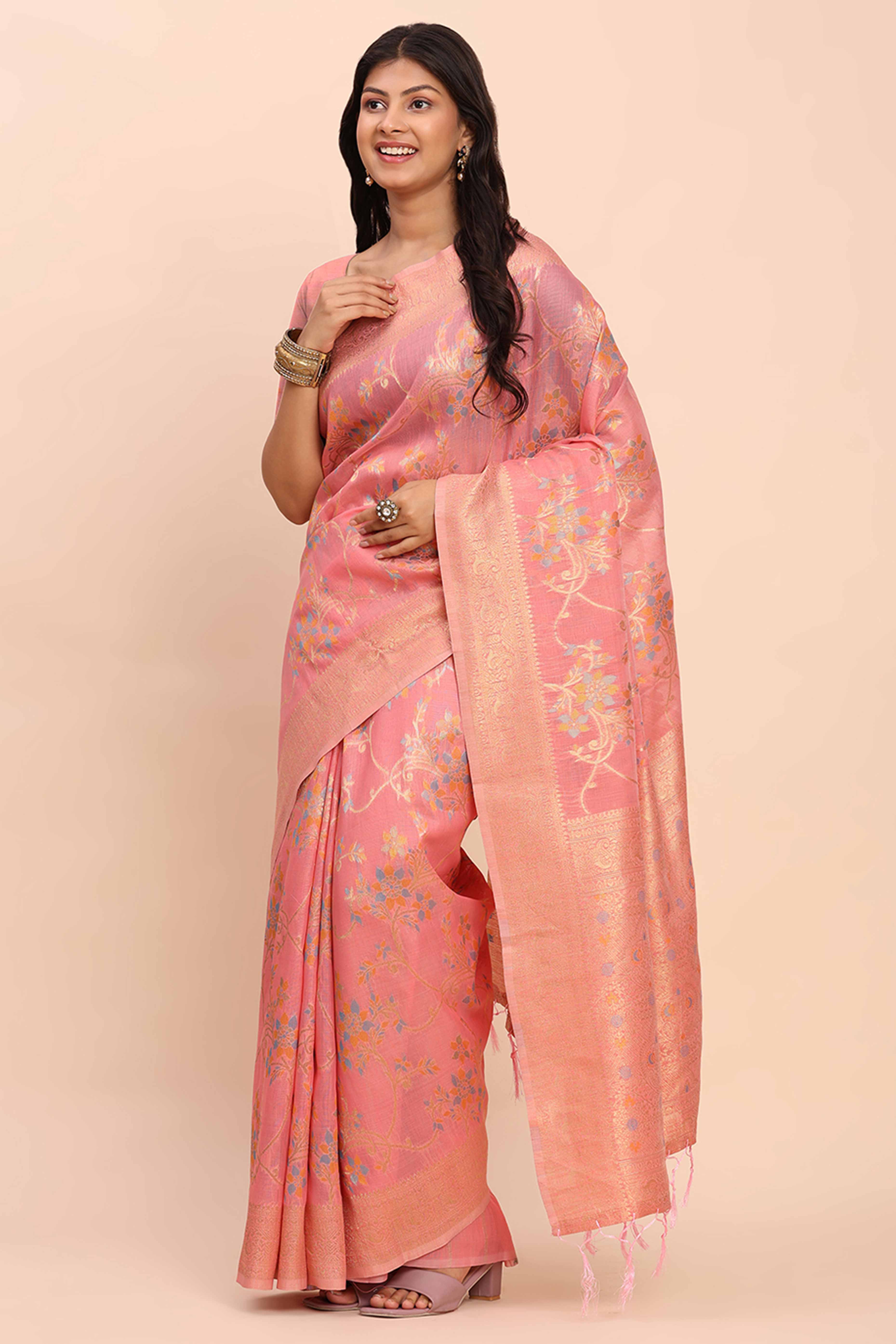 Salmon Pink Linen Cotton Saree Showcasing Floral Zari Weaves & A Tasselled Finish Pallu