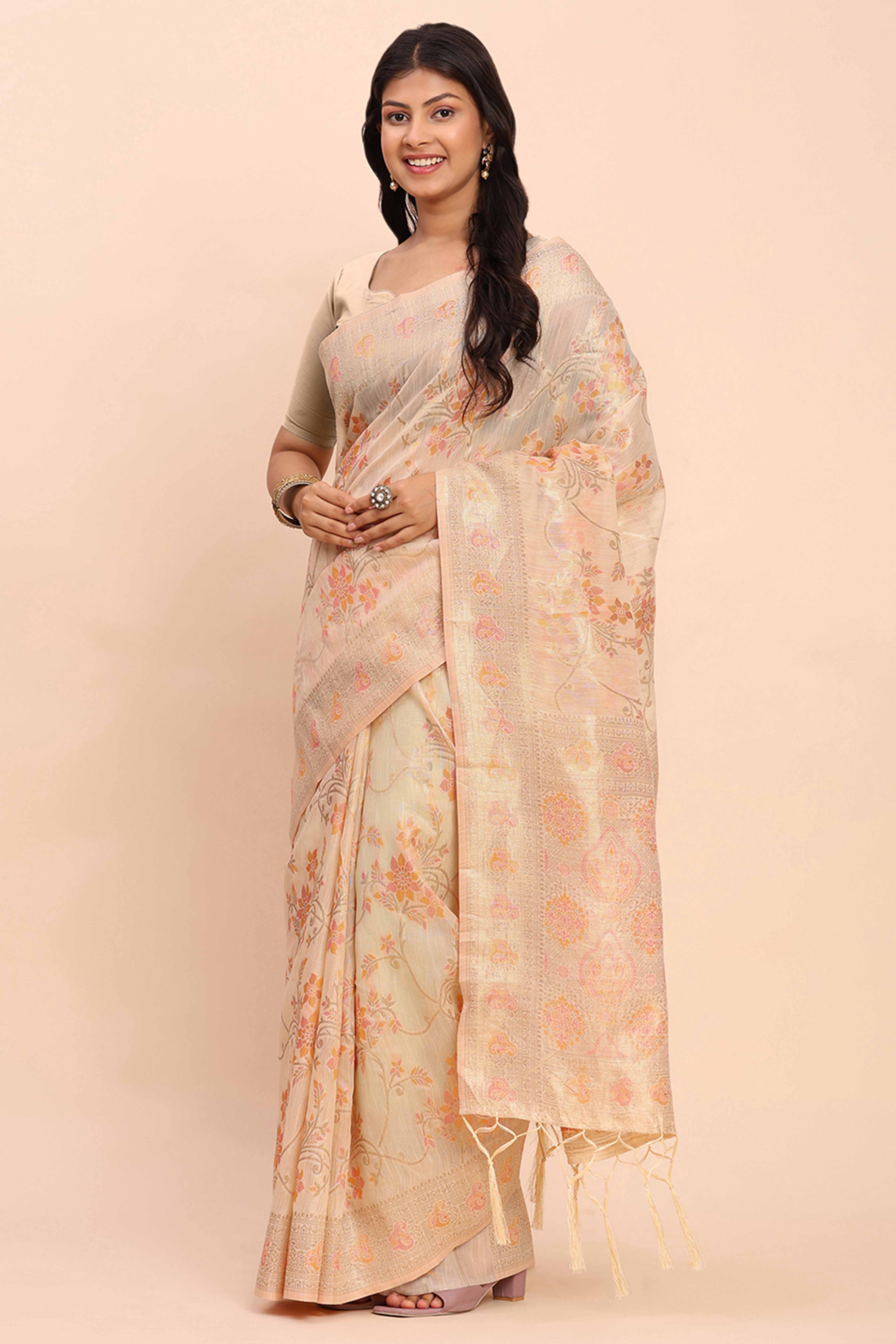 Cream Linen Cotton Saree Showcasing Floral Zari Weaves & A Tasselled Finish Pallu