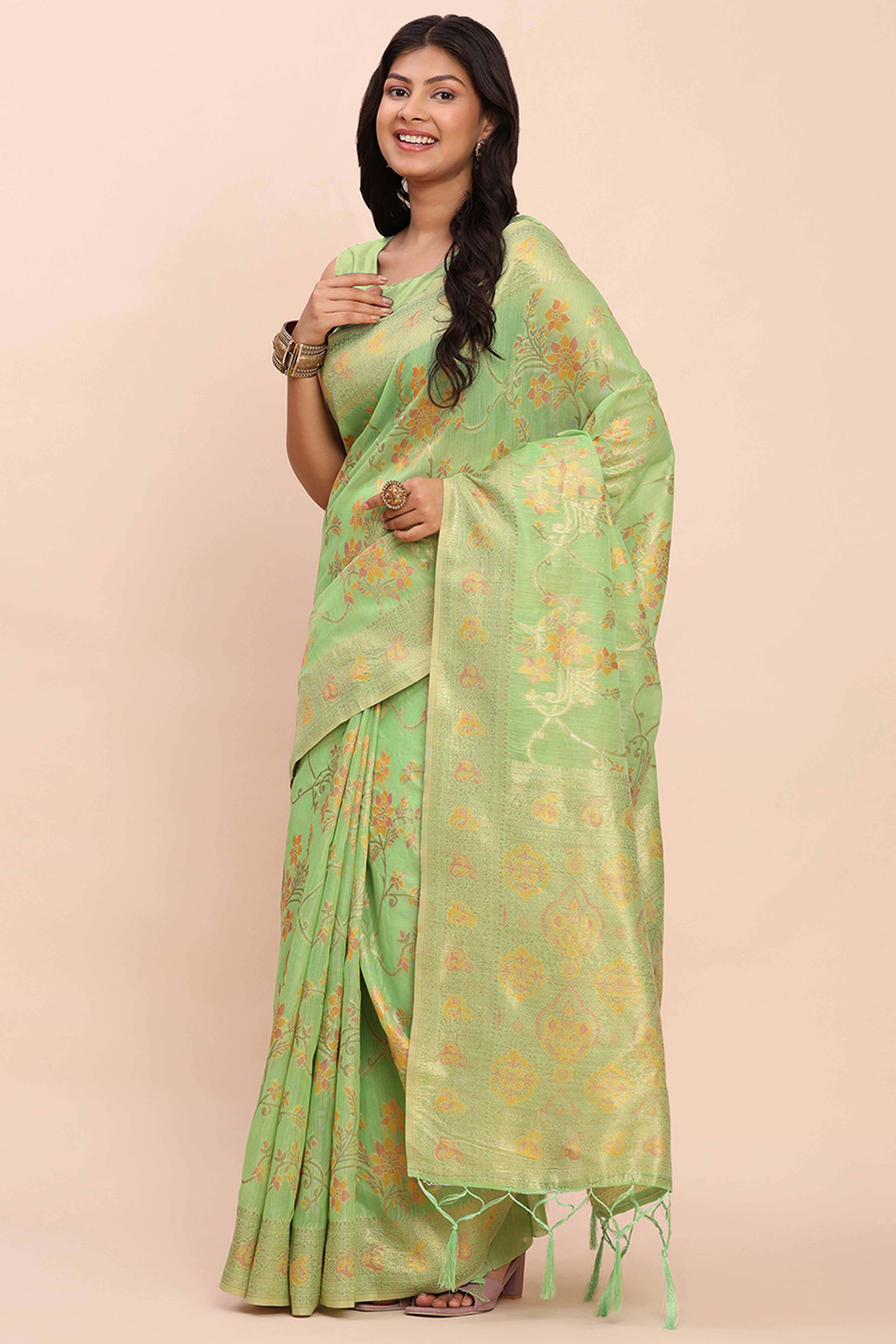 Green Linen Cotton Saree Showcasing Floral Zari Weaves & A Tasselled Finish Pallu