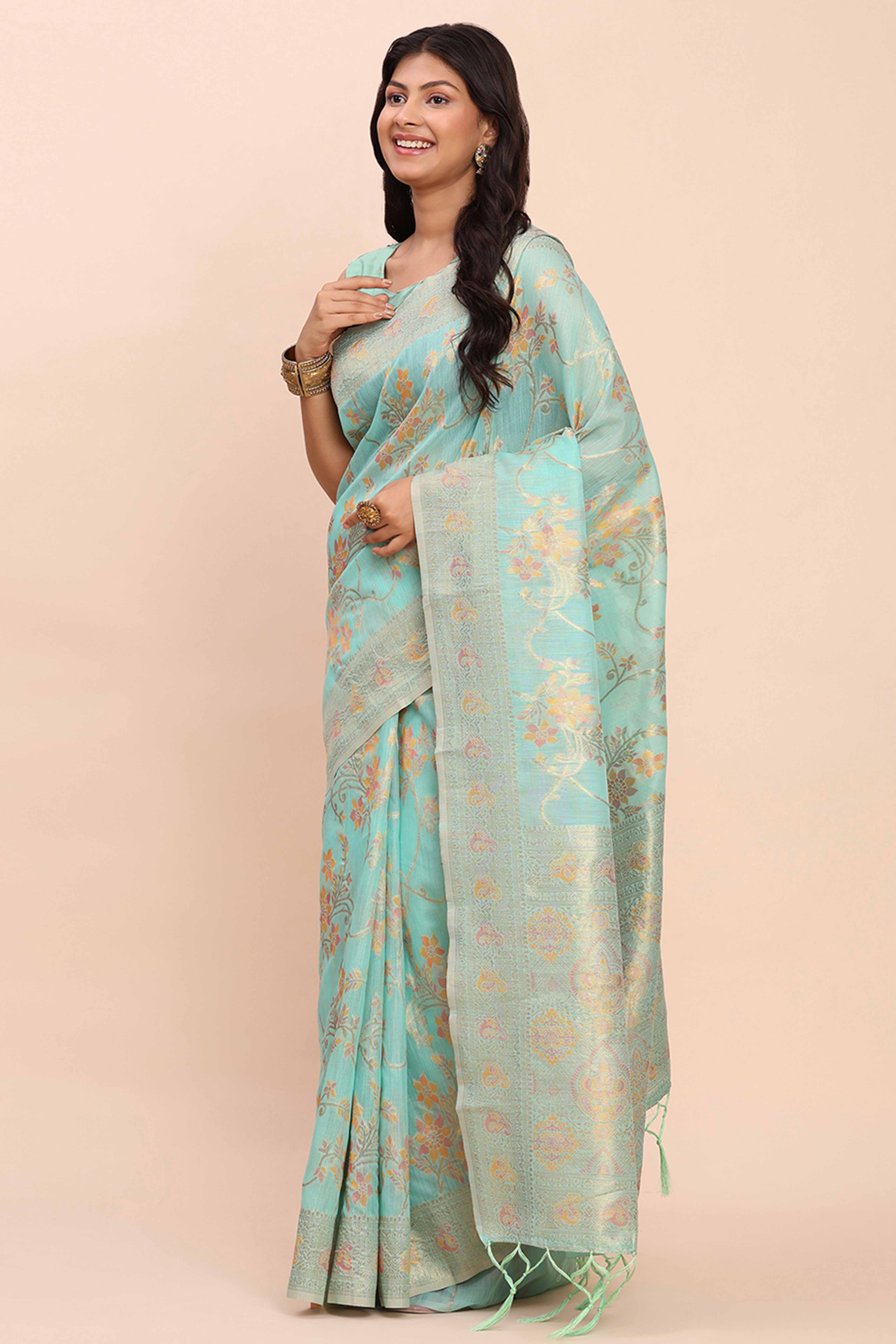 Turquoise Linen Cotton Saree Showcasing Floral Zari Weaves & A Tasselled Finish Pallu