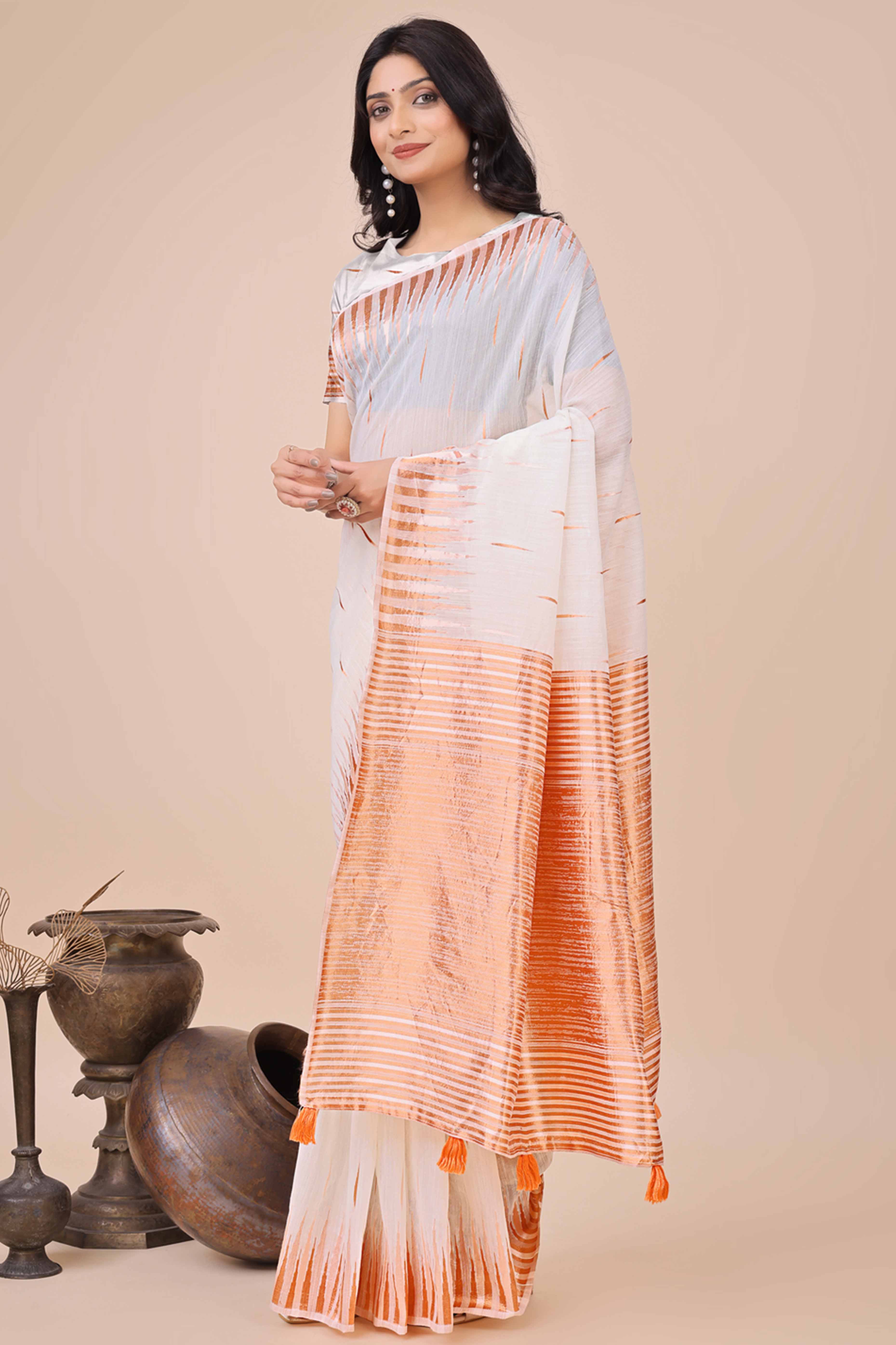 White Saree In Linen Cotton With Exquisite Zari Weaving & Subtle Tassel Border