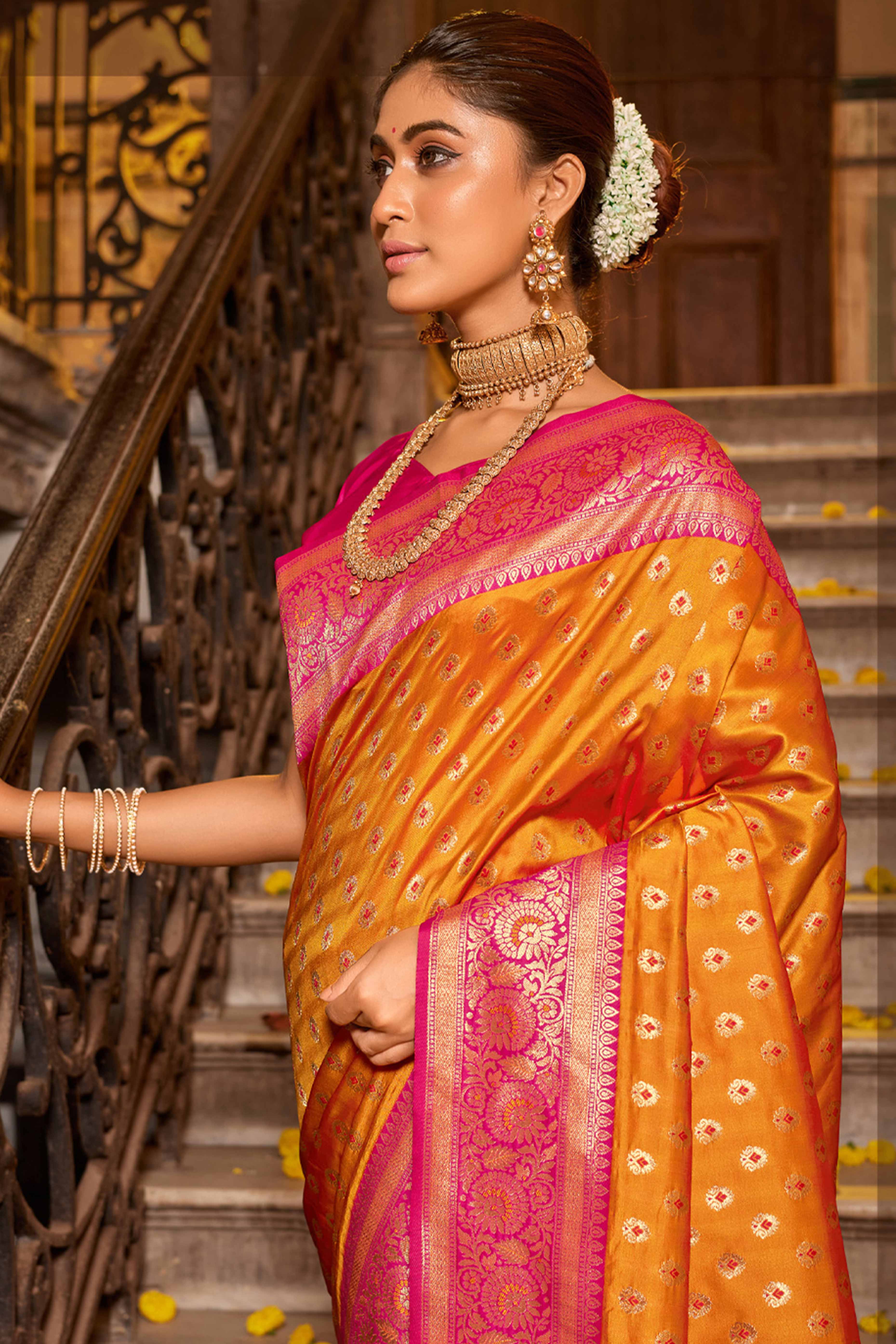 Orange Banarasi Silk Saree Featuring Intricate Floral Weaving & Elegant Tassel Pallu