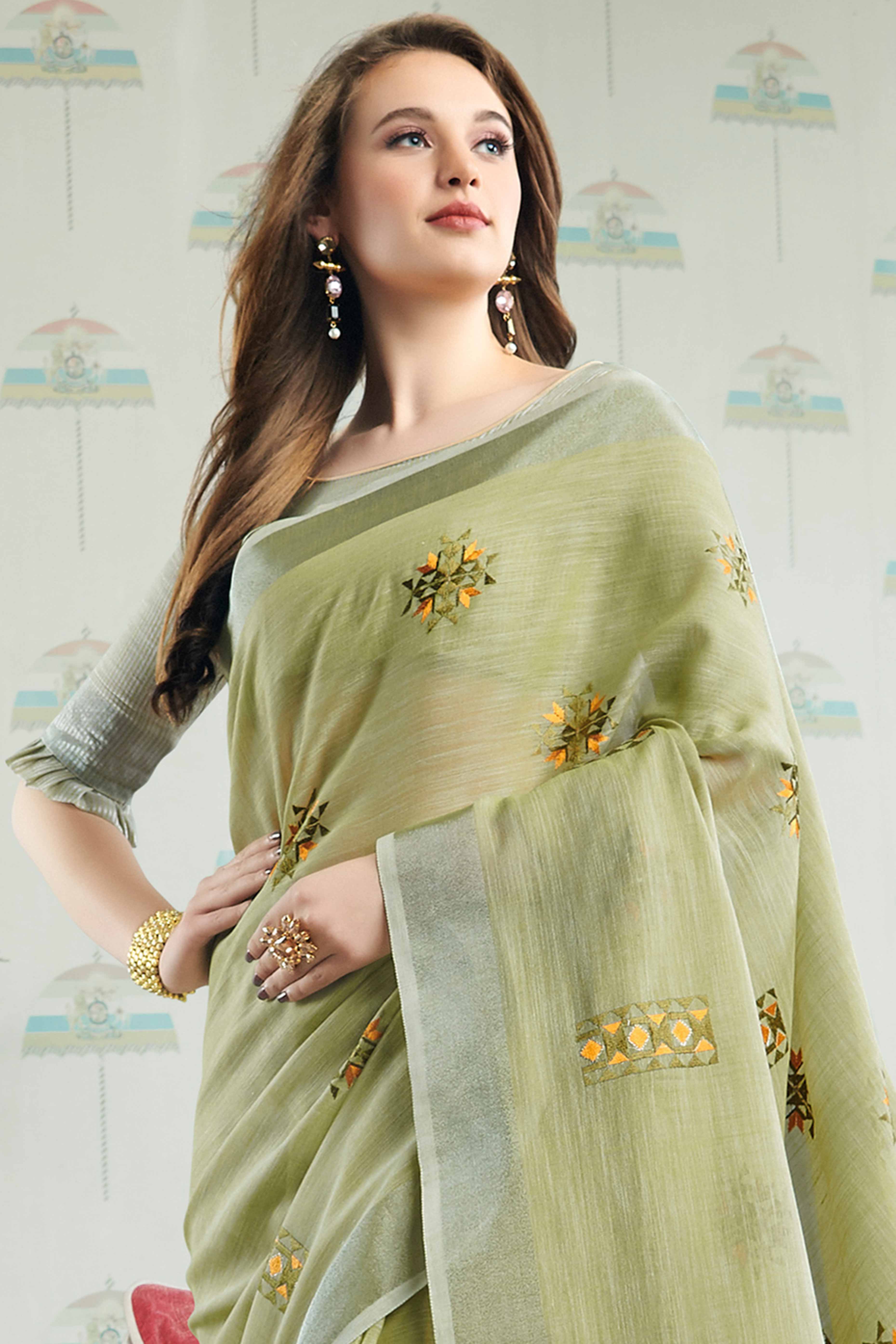 Pista Green Linen Saree with Intricate Floral Embroidery and Classic Weaving