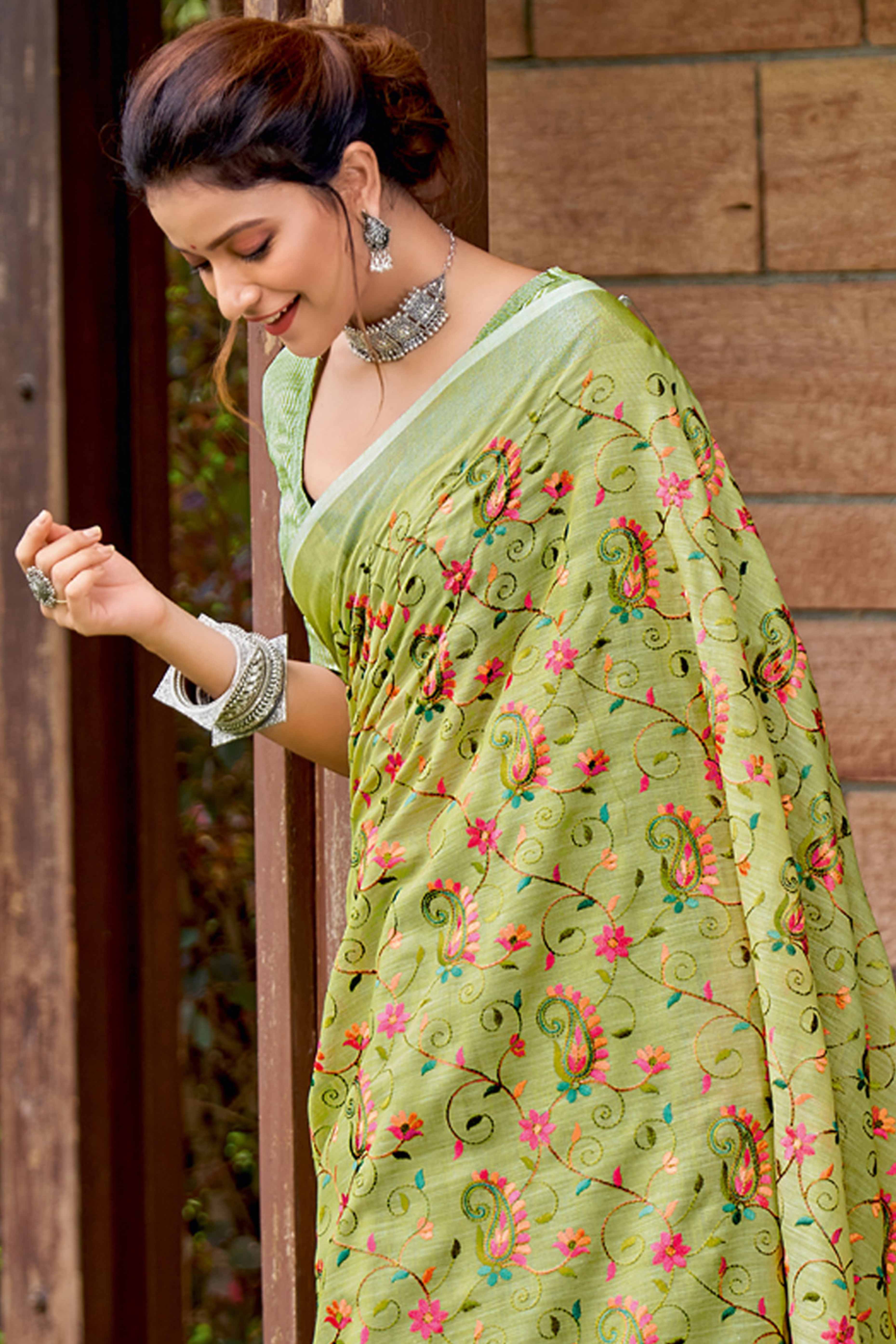 Handwoven Green Linen Saree with Floral Embroidered Patterns