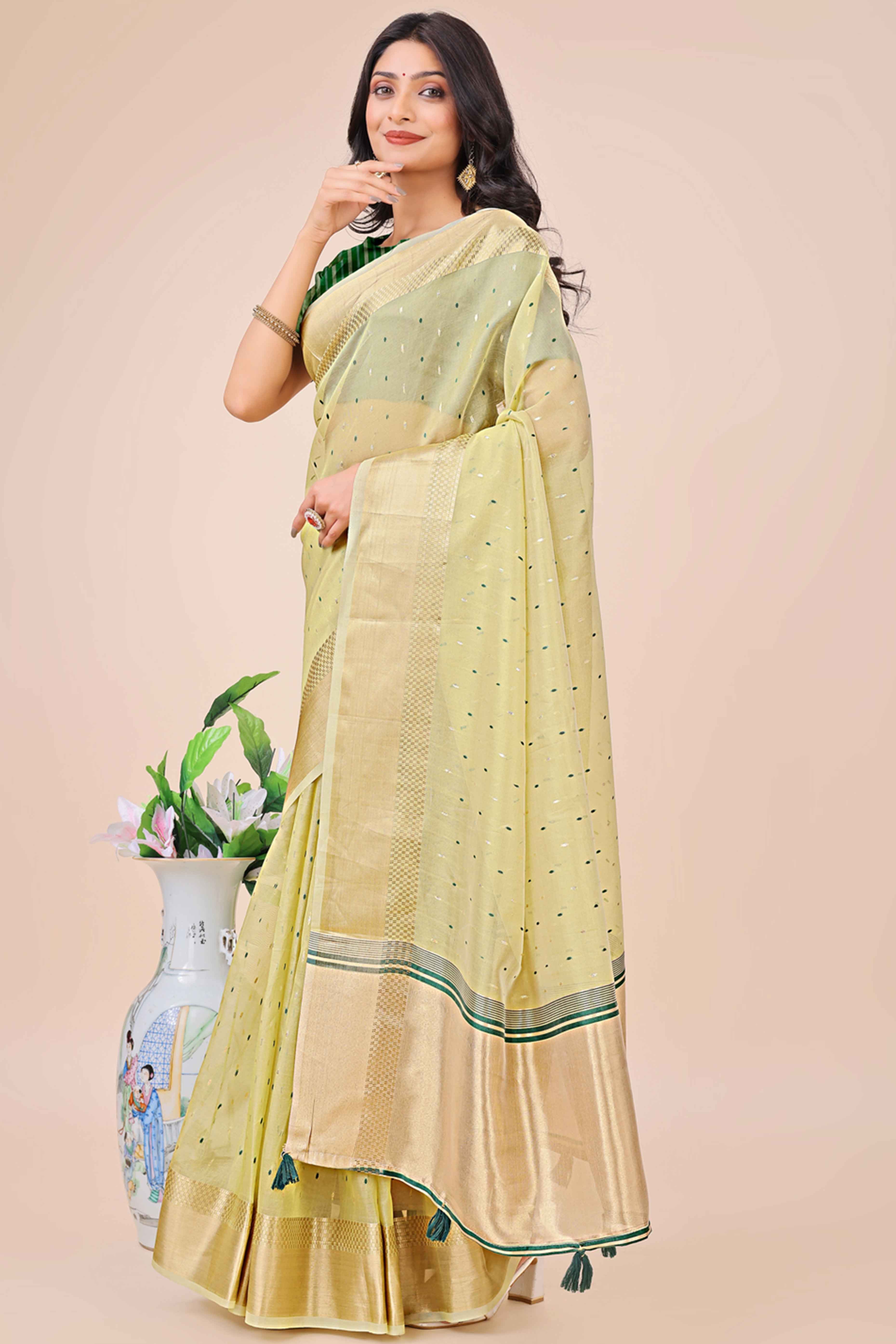 Light Green Organza Saree Adorned With Fine Zari Weaving & Stylish Tassel Edging