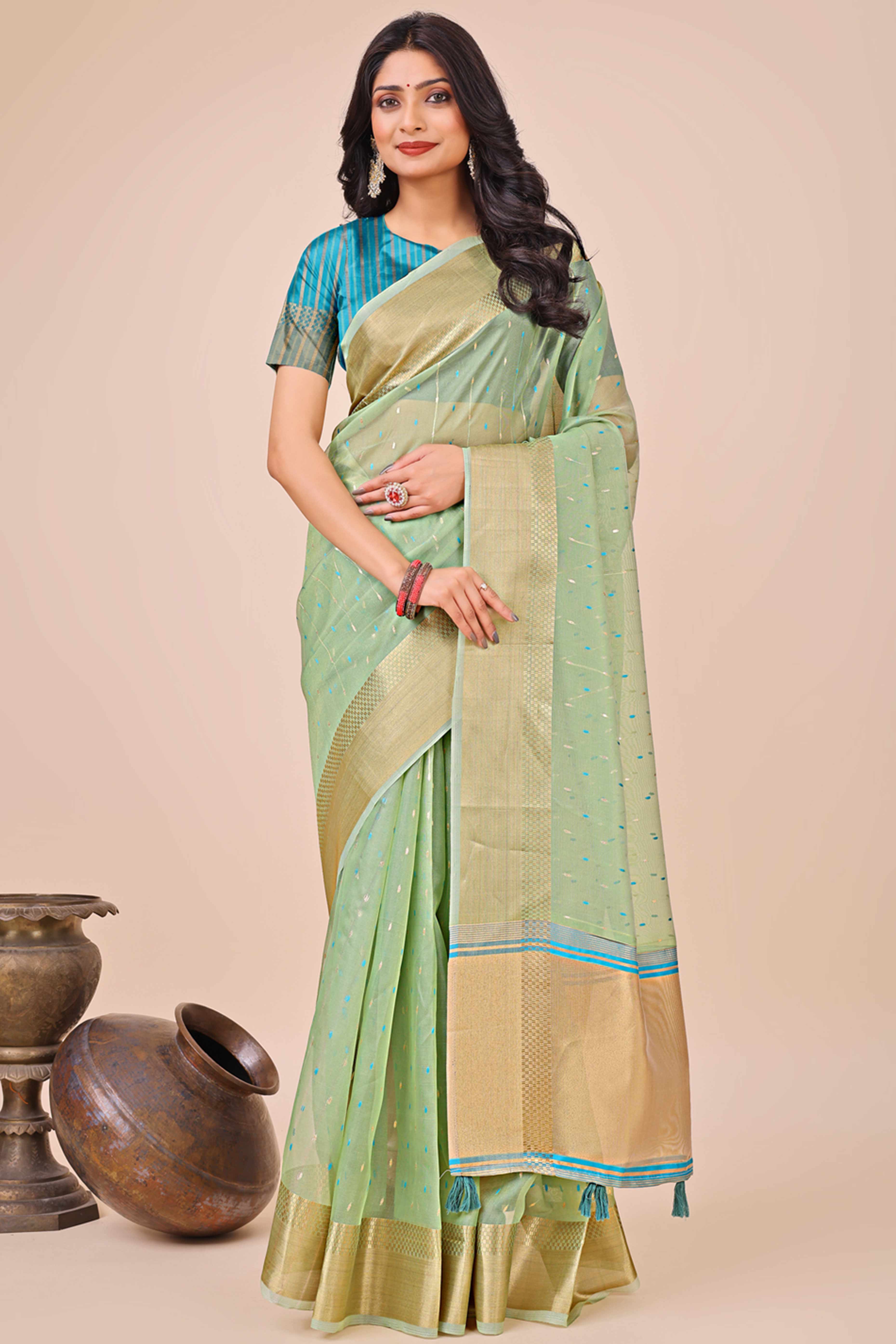 Pista Green Organza Saree Adorned With Fine Zari Weaving & Stylish Tassel Edging
